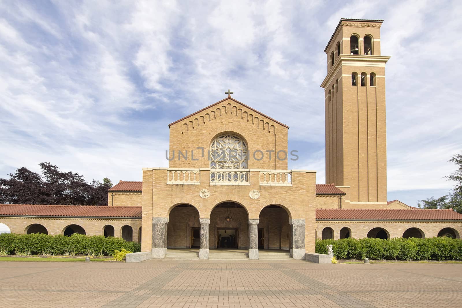 Mount Angel Abbey Catholic Church in St Benedict Oregon Against Blue Sky and Clouds Front Entrance View