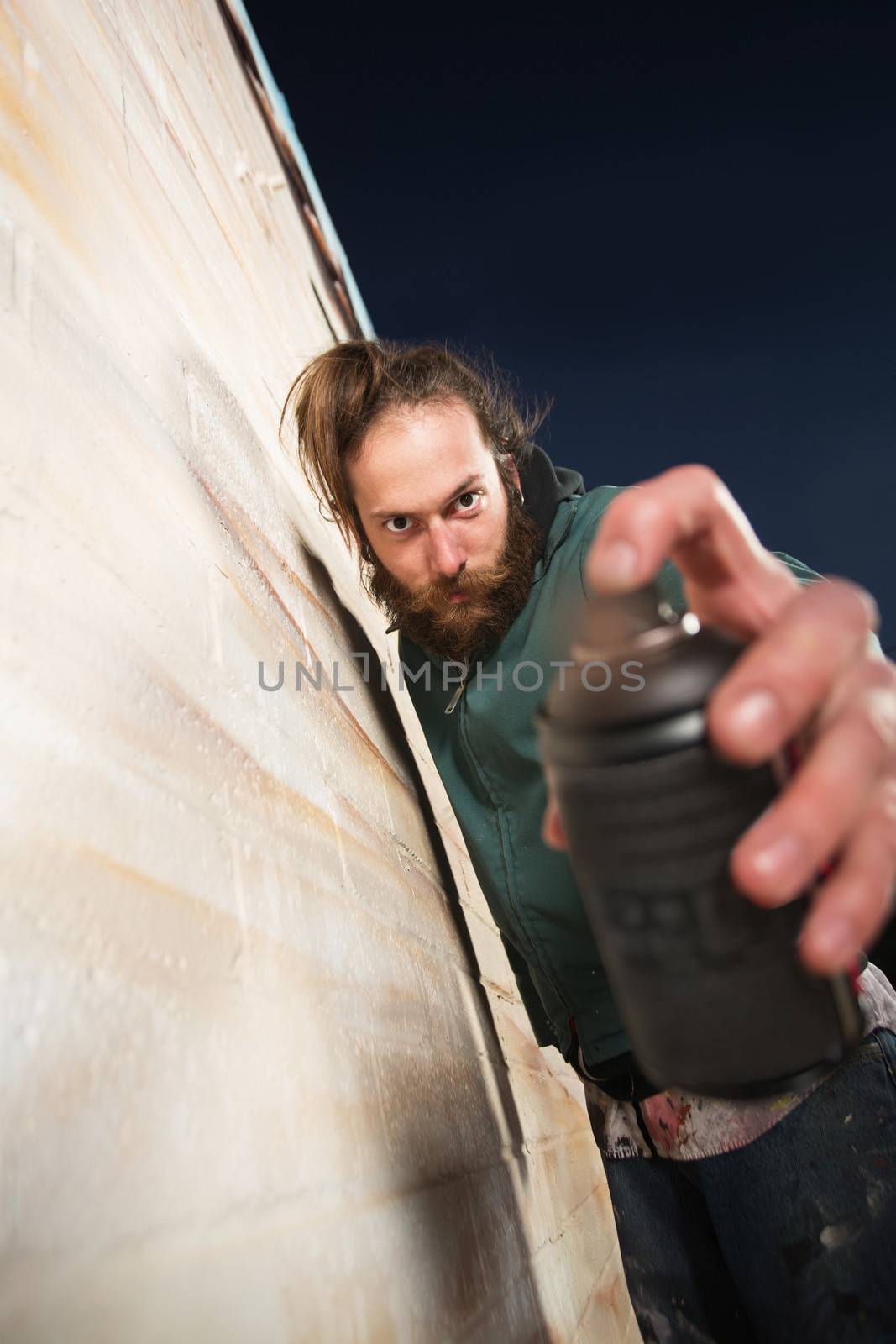 Close up of spray paint can held by graffiti artist