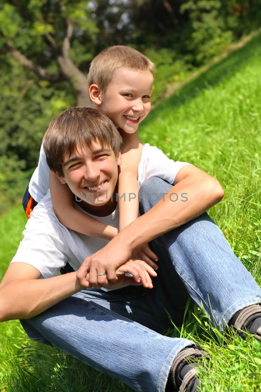 happy brothers in the summer park