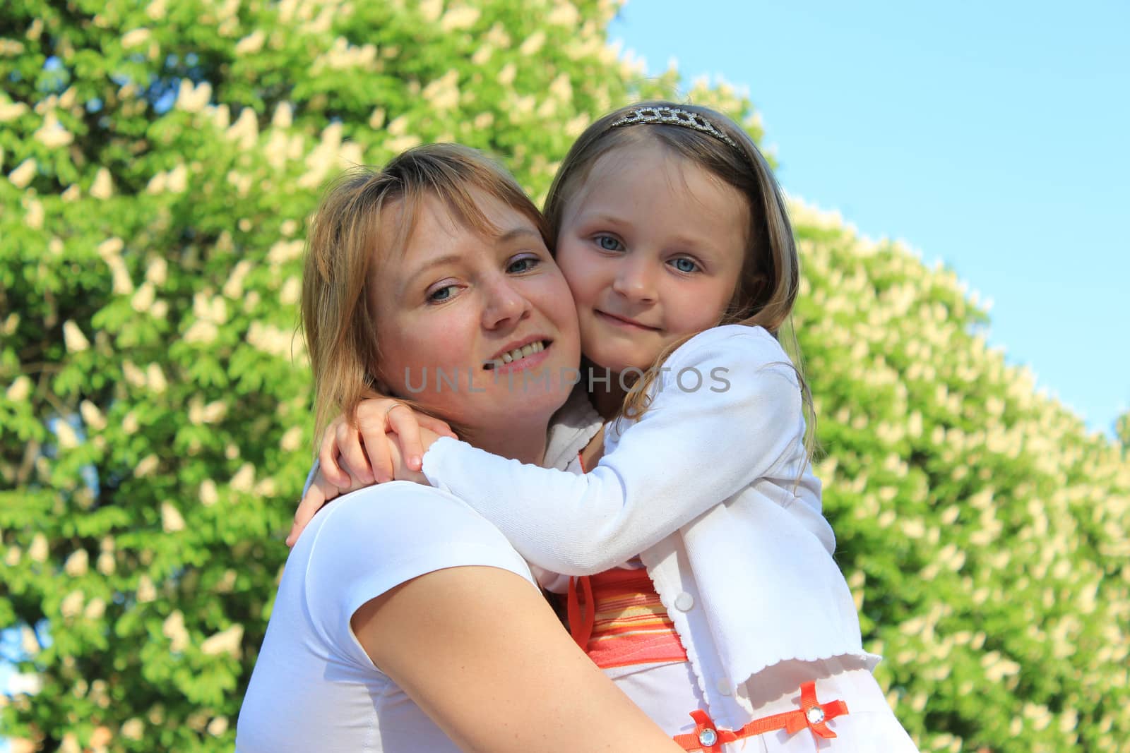 image of mother and daughter are hugging one another