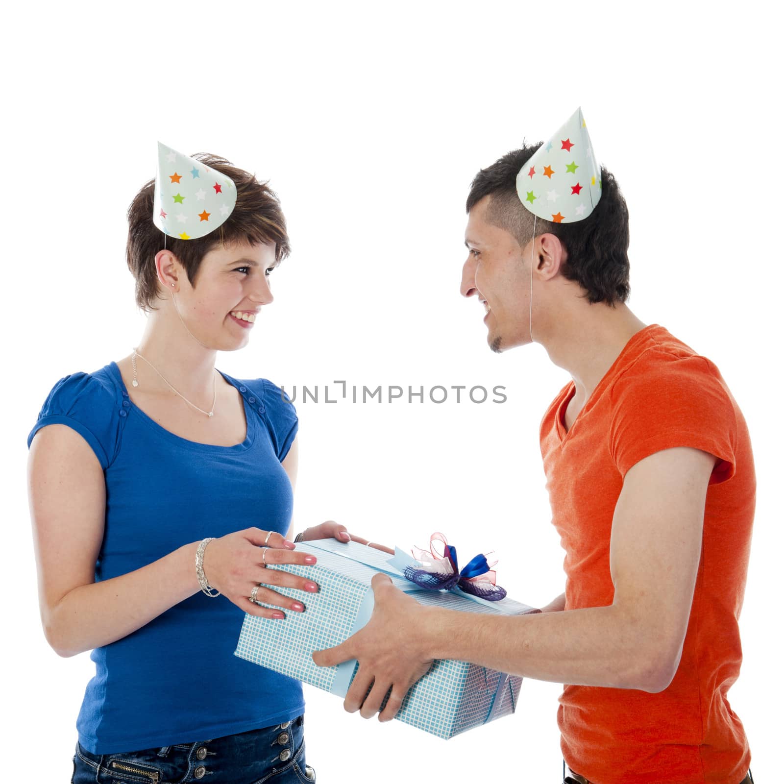 a happy boy is having a present for his birthday girl on a white background