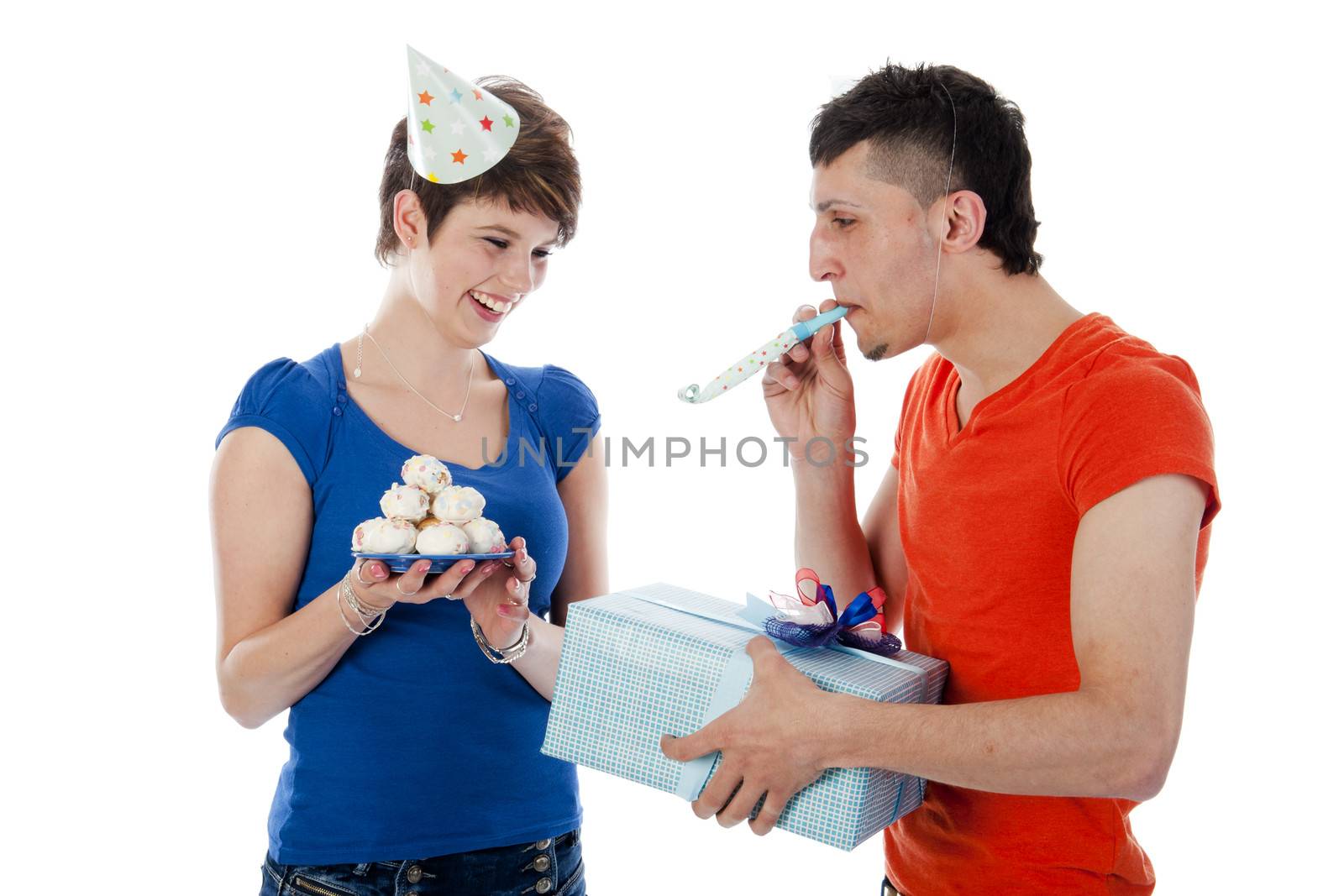 a happy boy is having a present for his birthday girl on a white background