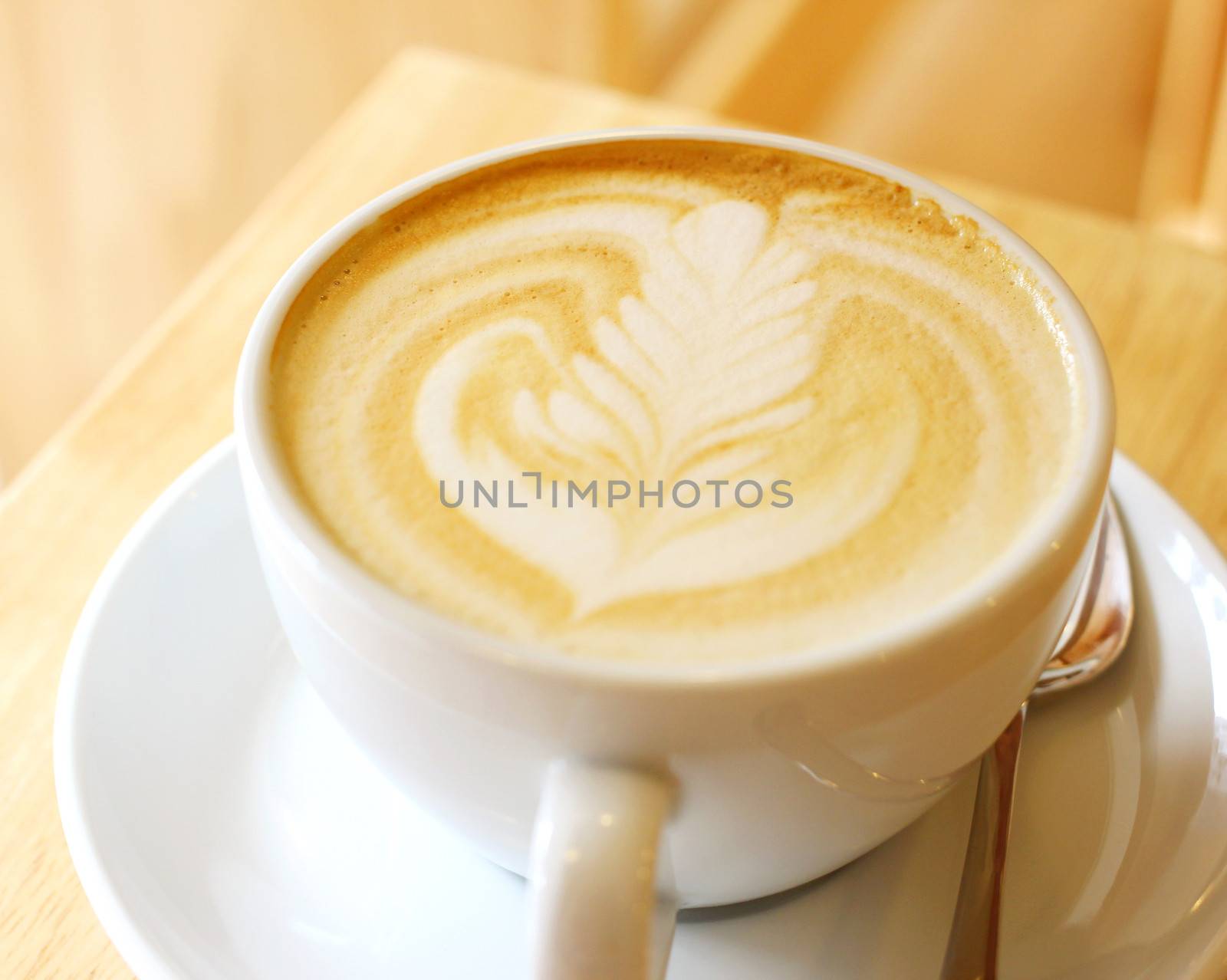 Cup of art latte or cappuccino coffee  by nuchylee
