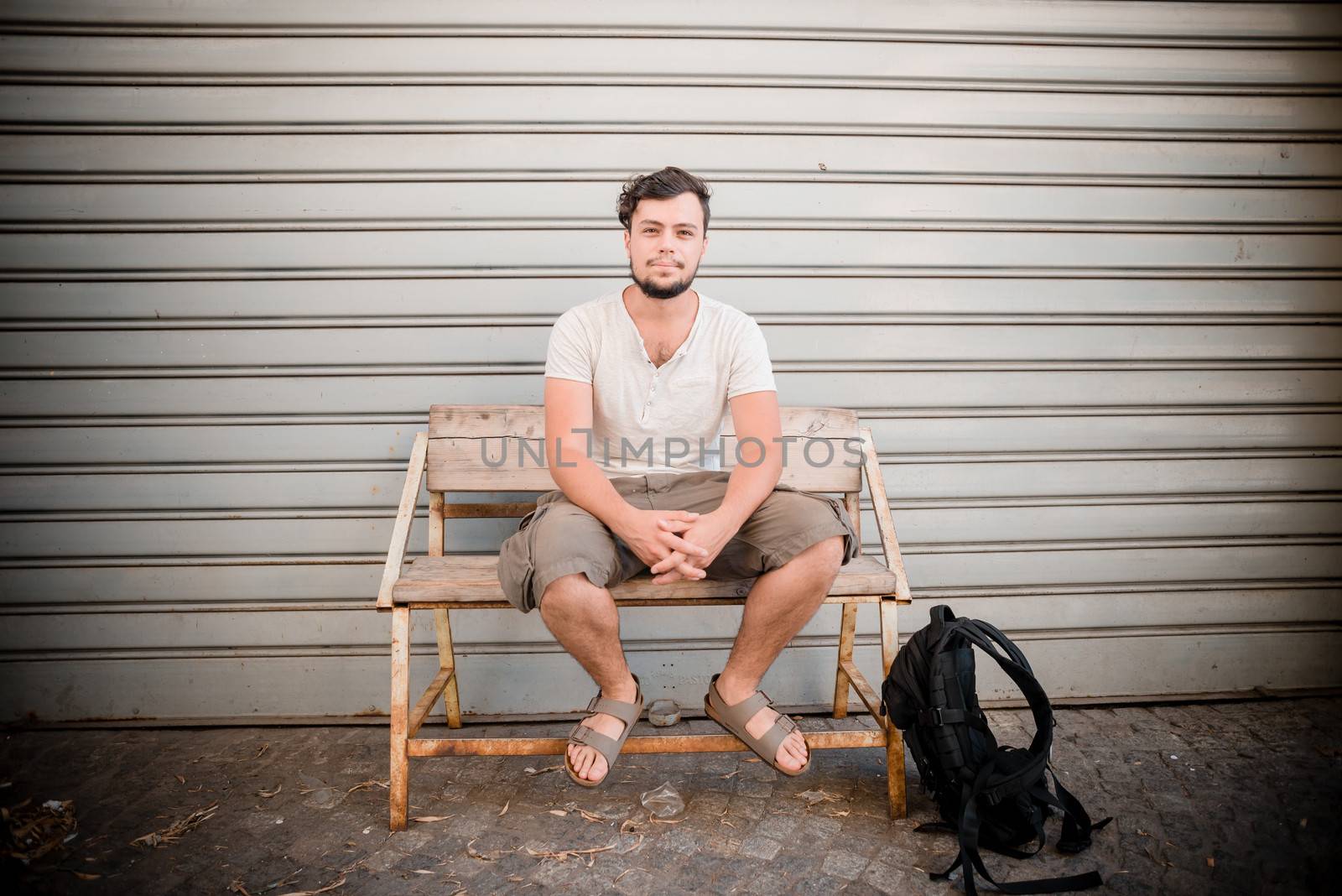 young stylish man sitting on a banch in the city







young stylish man sitting on a banch