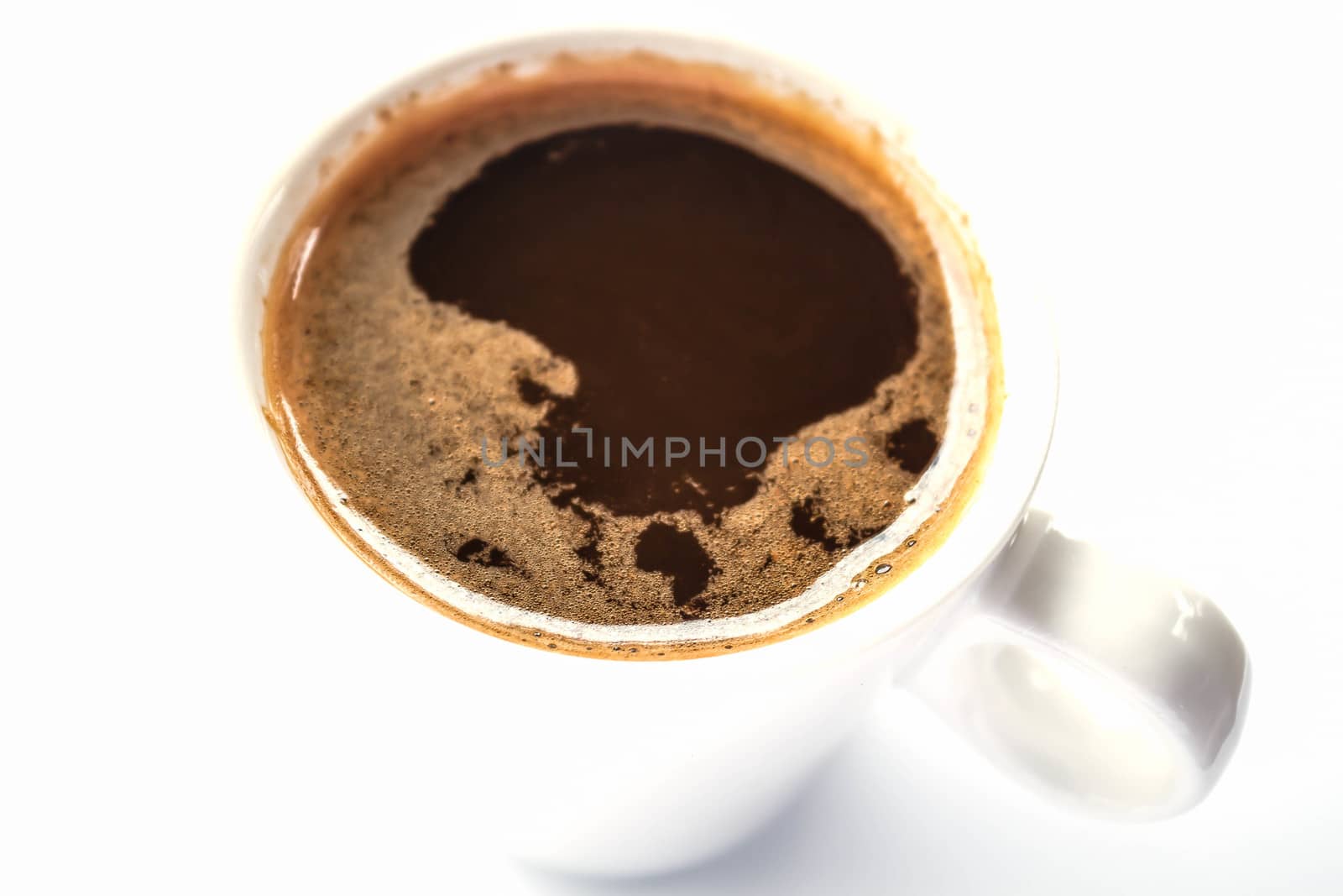 Golden ring of double espresso shots isolated on white background