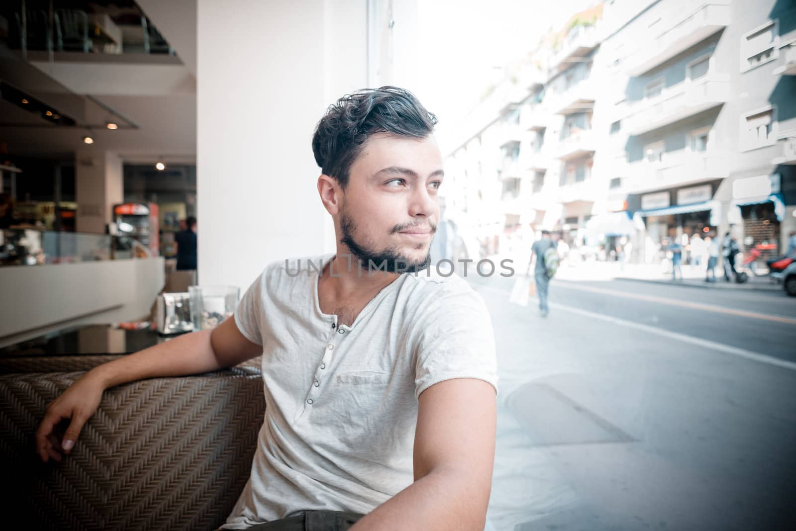 young stylish man in a bar in the city
