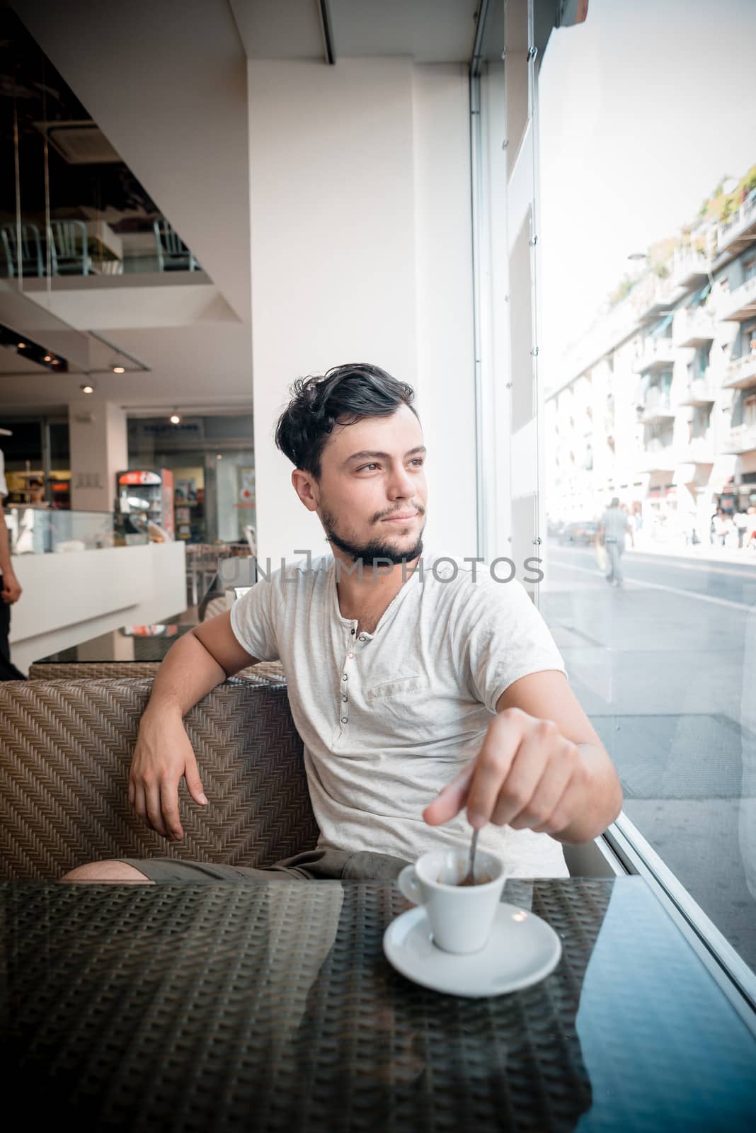 young stylish man in a bar in the city