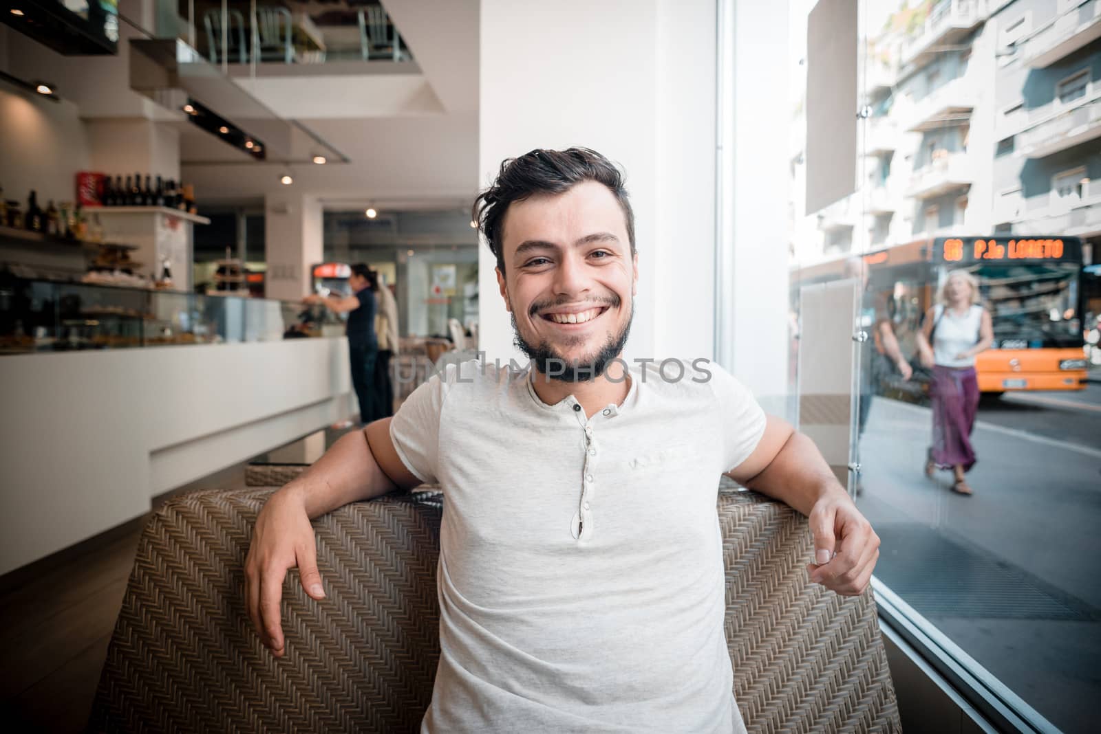 young stylish man in a bar in the city