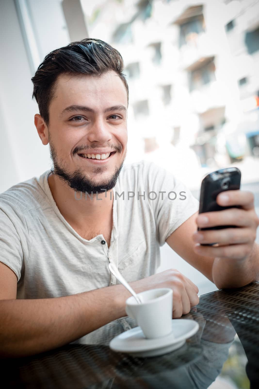 young stylish man in a bar in the city