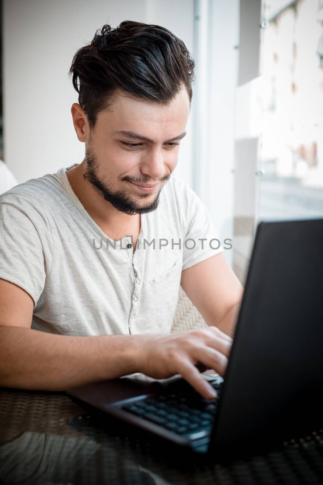 young stylish man in a bar by peus