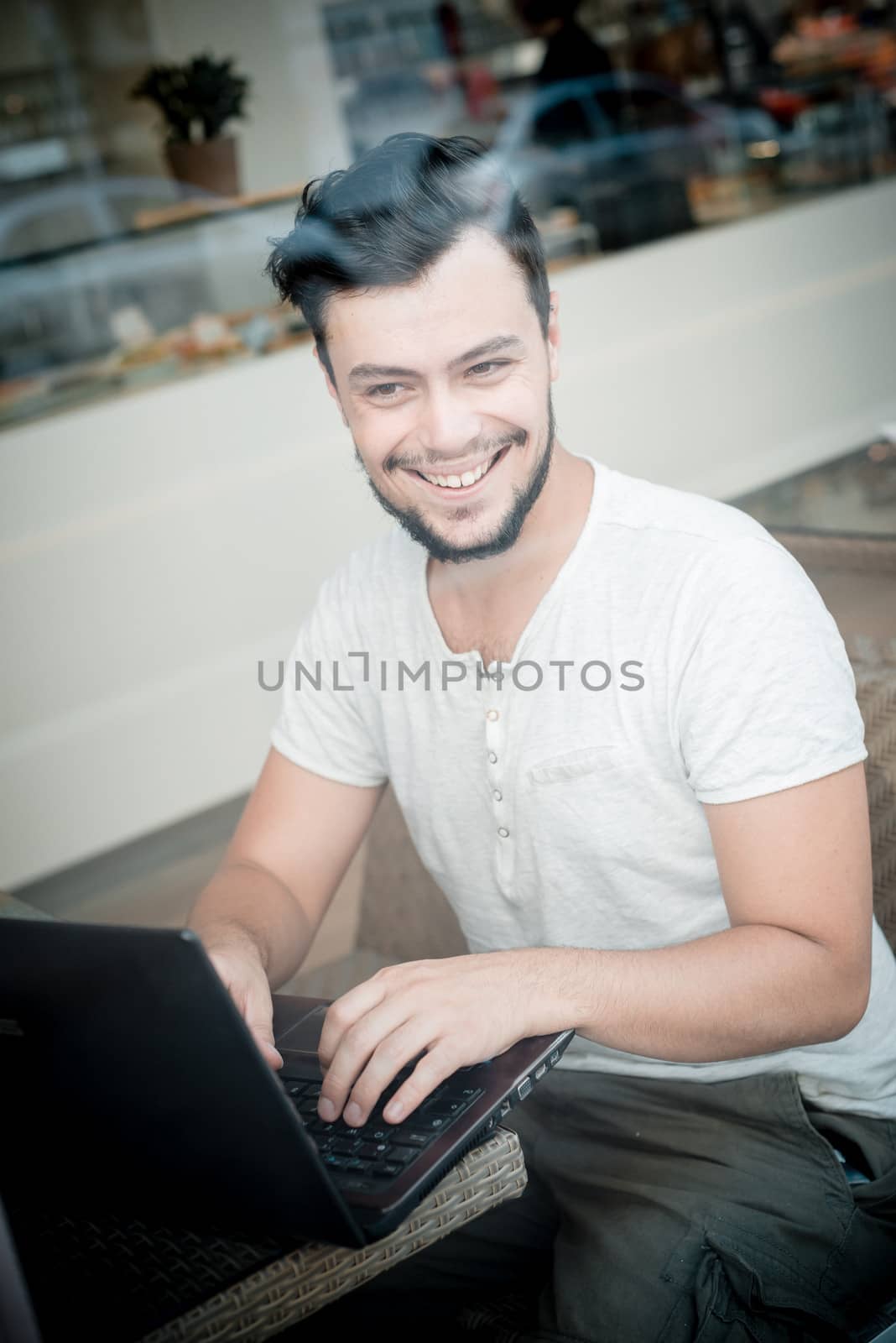 young stylish man in a bar in the city