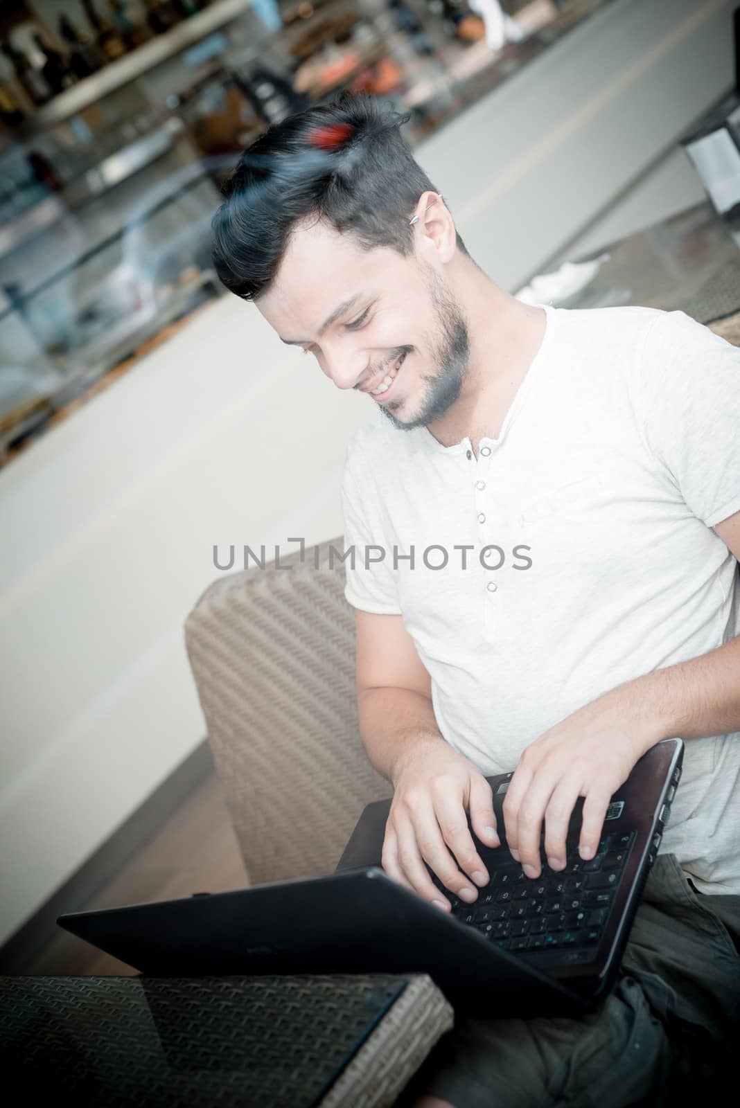 young stylish man in a bar in the city