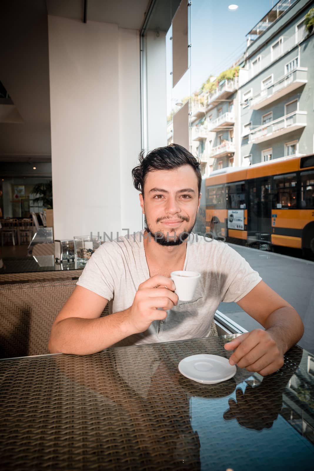 young stylish man in a bar in the city