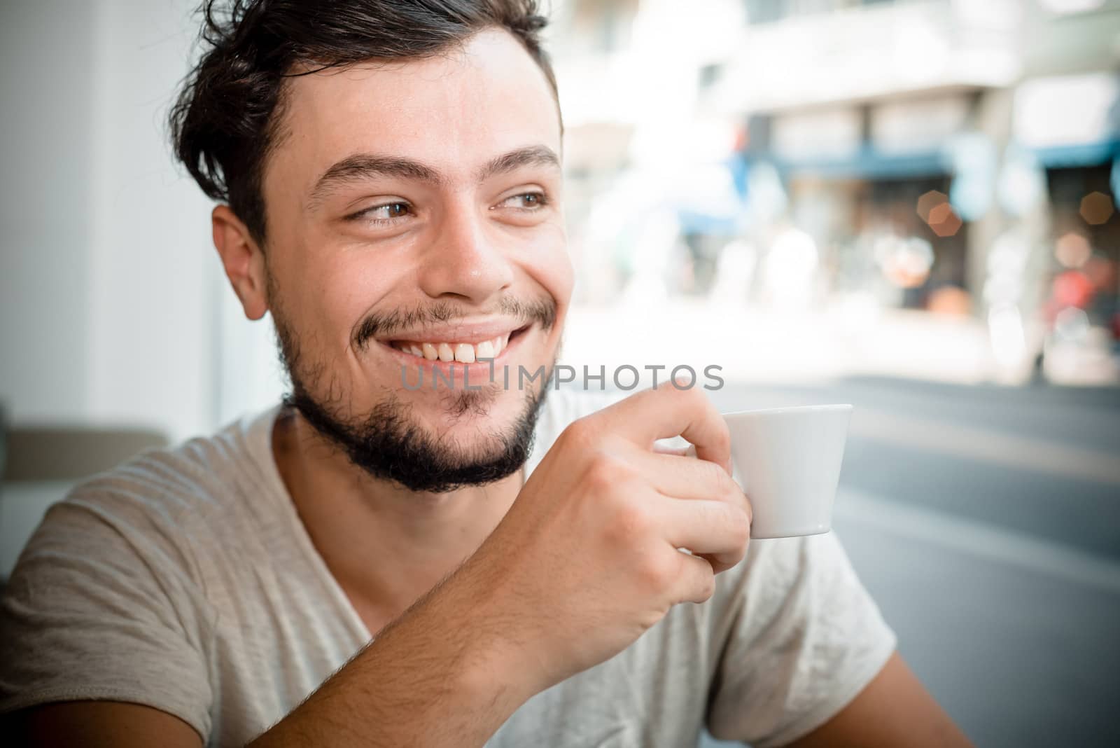 young stylish man in a bar in the city