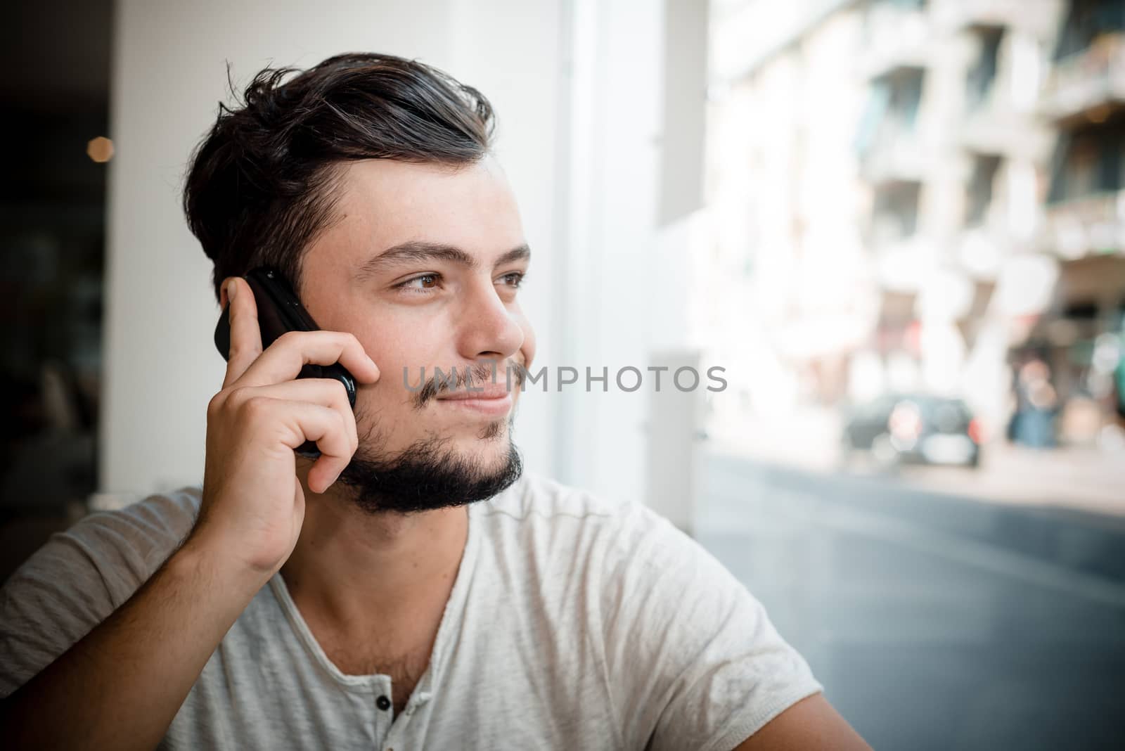 young stylish man in a bar in the city