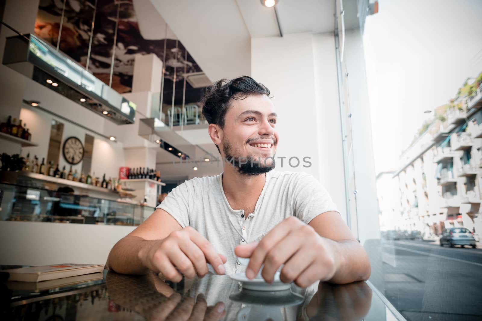 young stylish man in a bar in the city