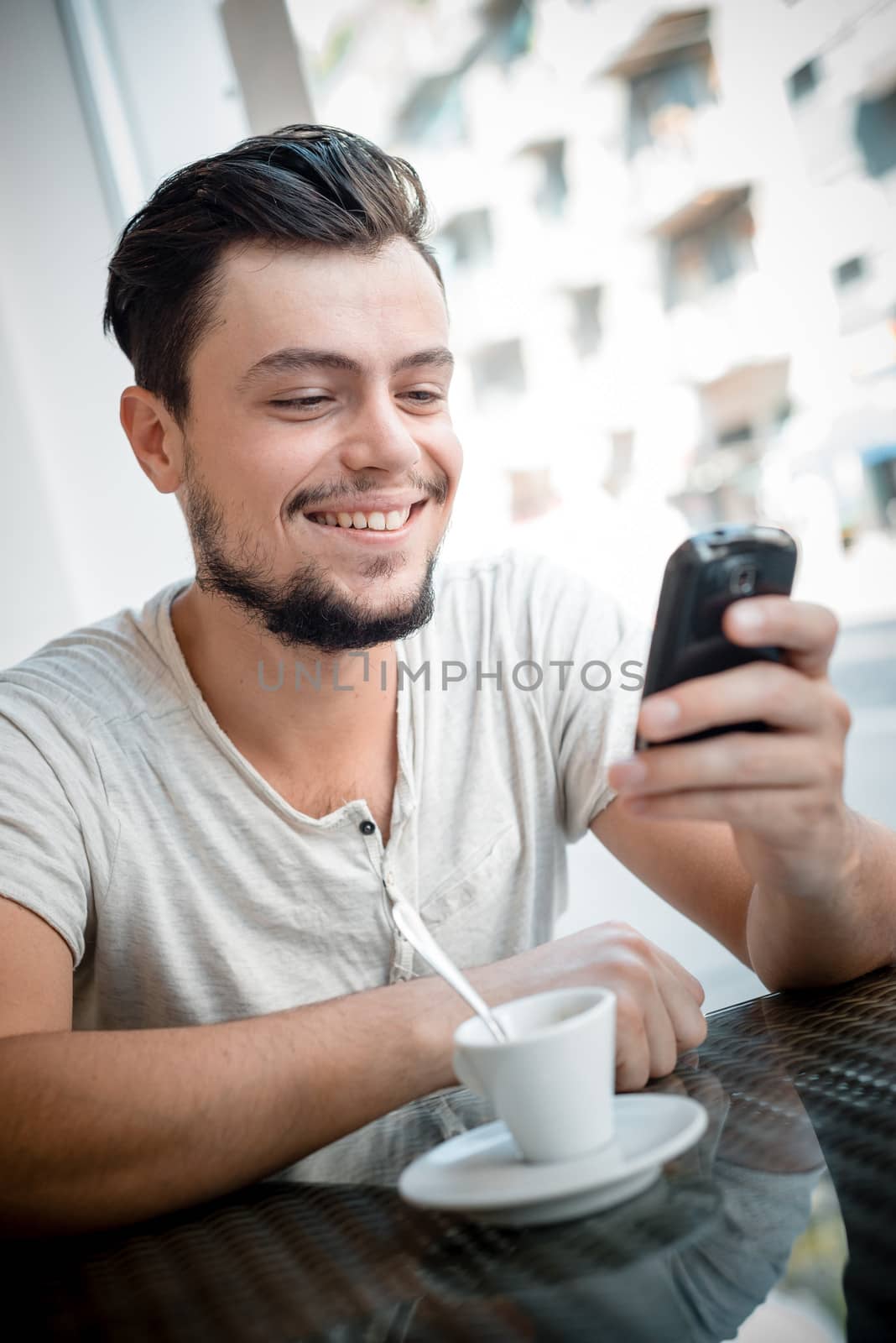 young stylish man in a bar in the city