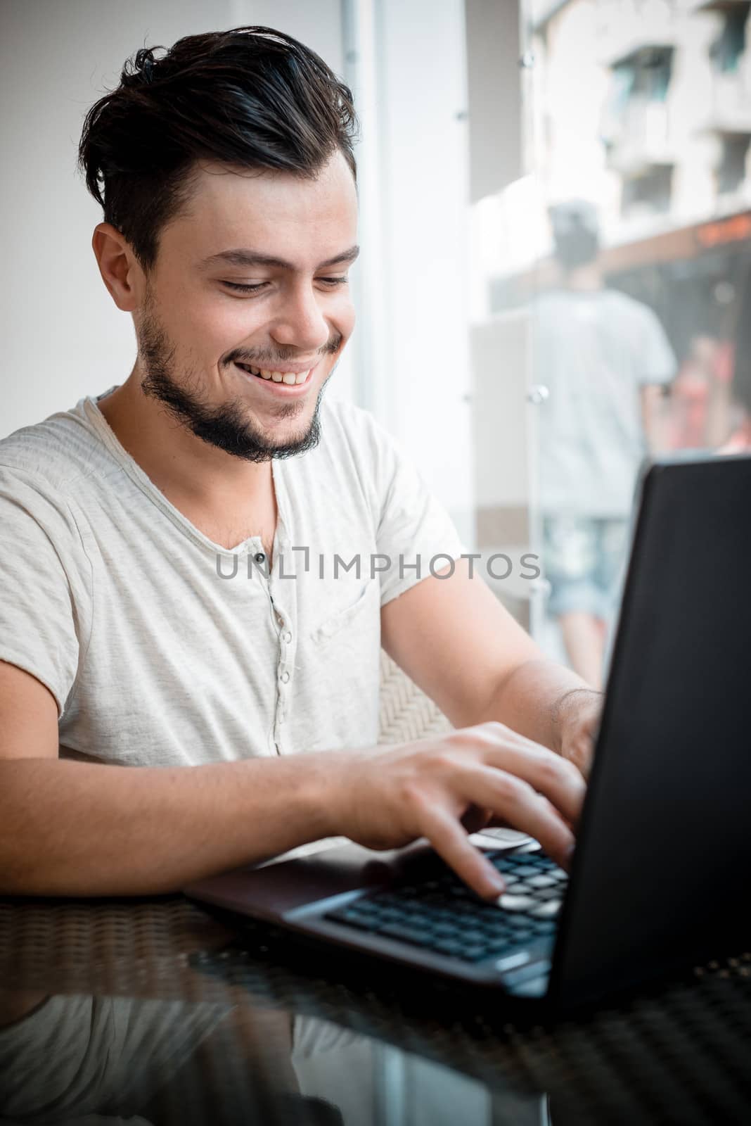 young stylish man in a bar in the city