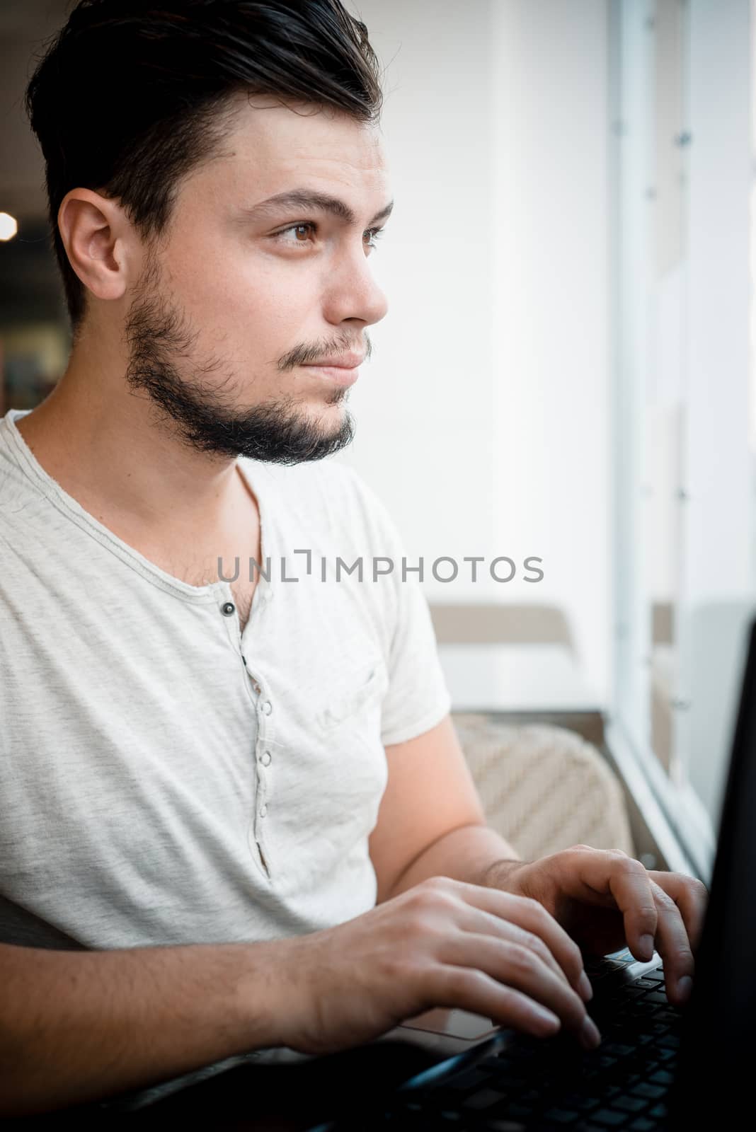 young stylish man in a bar in the city