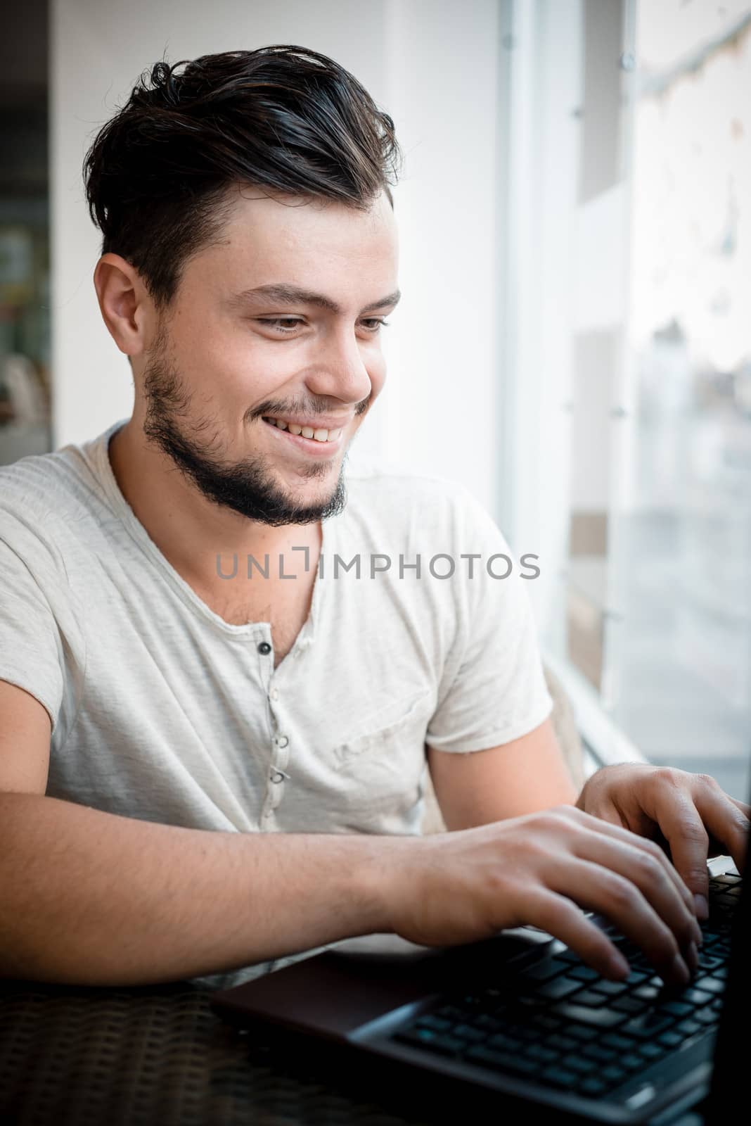 young stylish man in a bar in the city