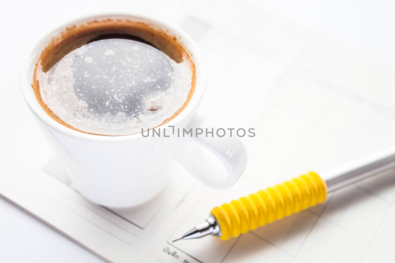 Work paper and pencil with hot espresso by punsayaporn