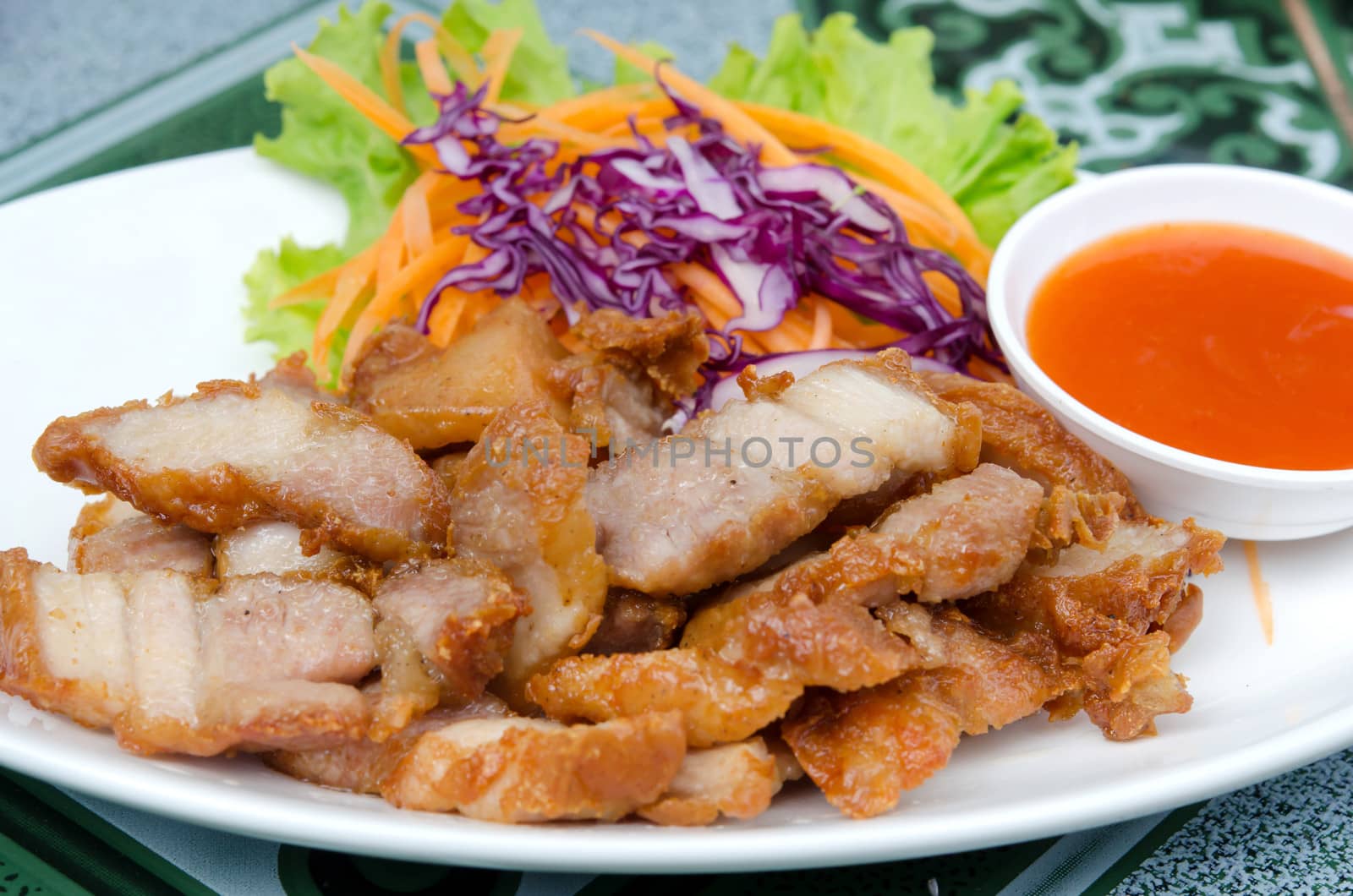 fried pork  served with fresh  vegetable and chili sauce