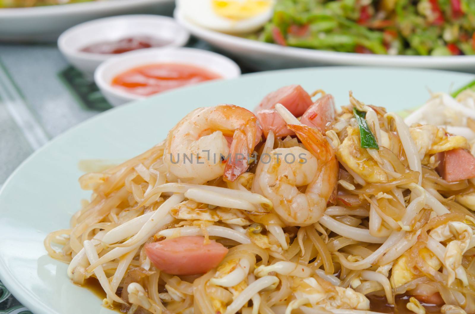 Pad Thai  is  stir fried  noodles with shrimp ,sausage ,  egg  and vegetable ,