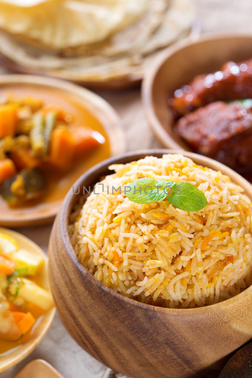 Biryani rice or pilaf rice with curry, fresh cooked basmati rice with spices, delicious Indian food.