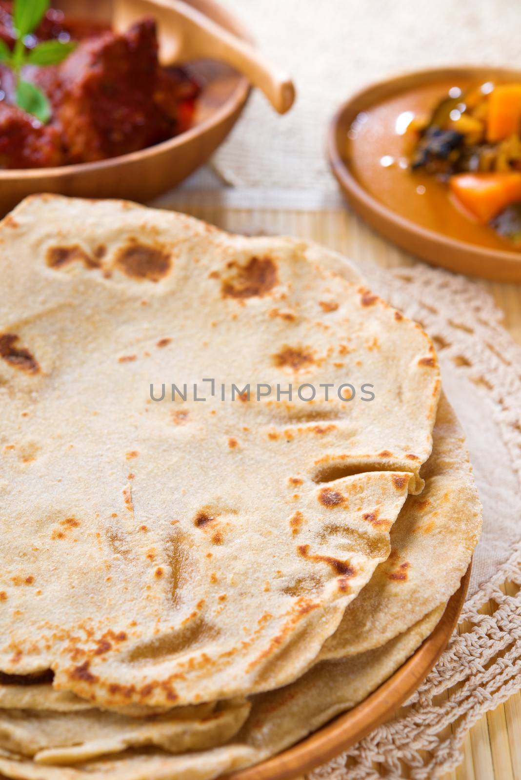 Chapati or Flat bread, Indian food, made from wheat flour dough. Chapatti,  Dhal and curry.