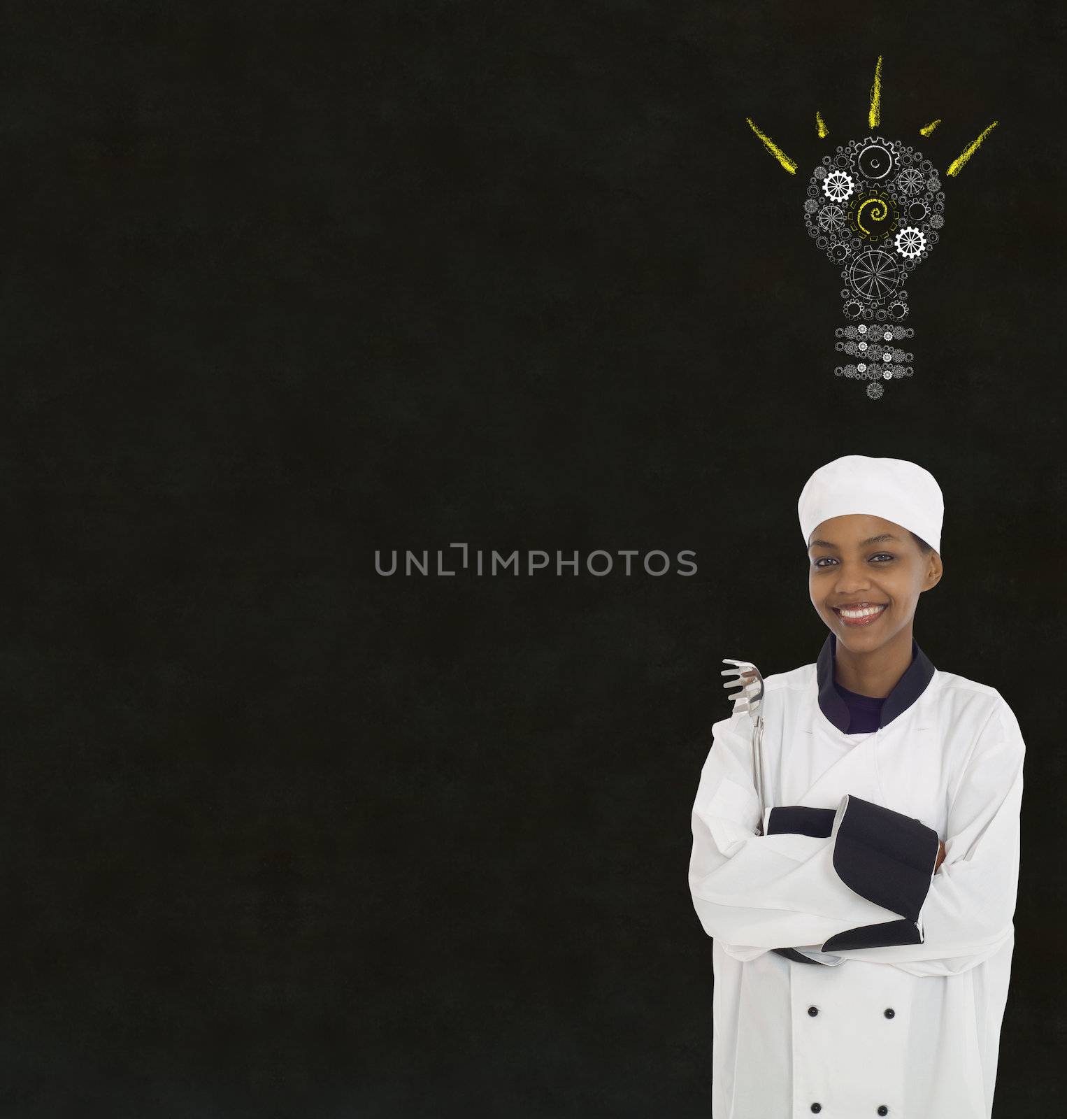 Bright idea gear cog lightbulb thinking African or African American woman chef on chalk blackboard background