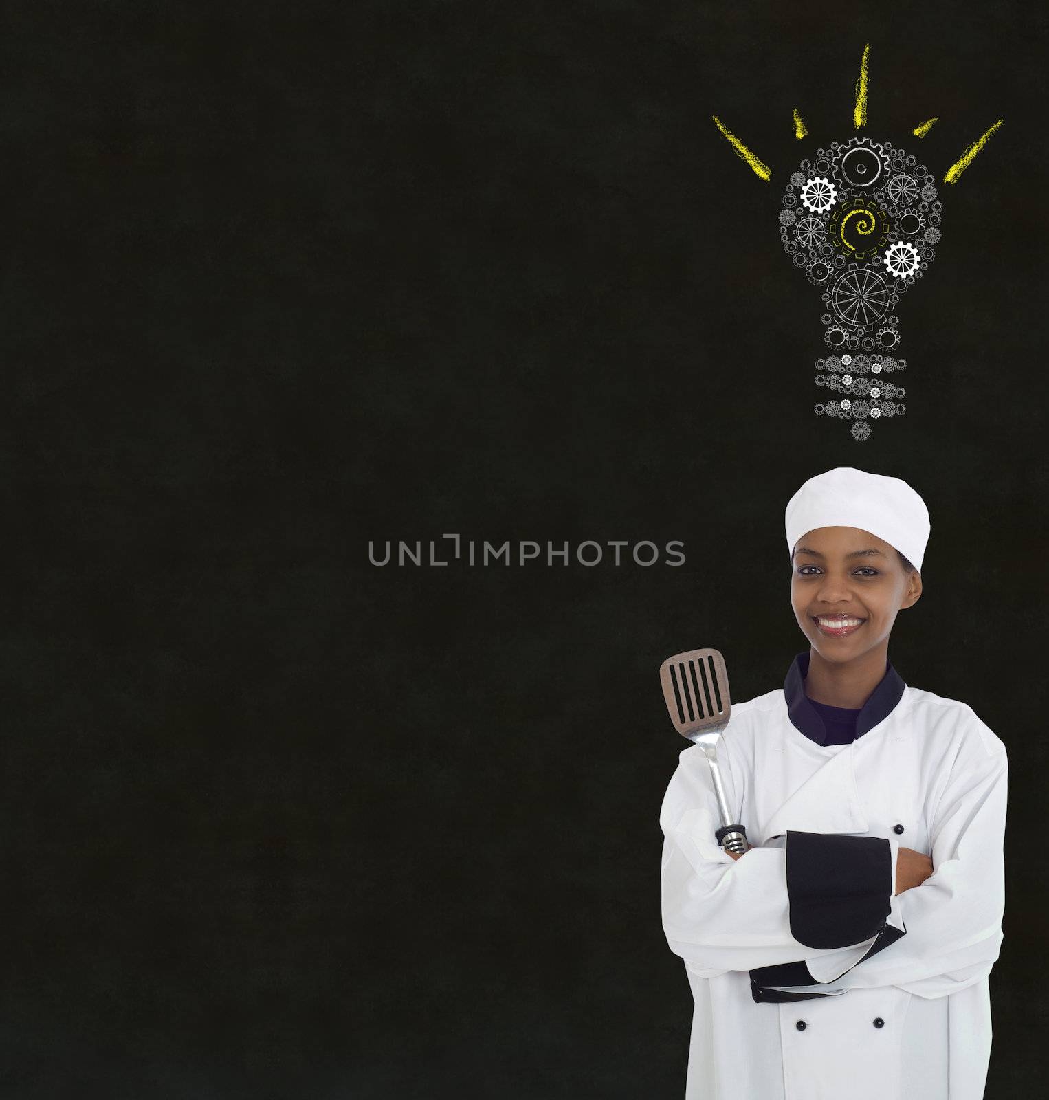 Gear cog lightbulb idea African woman chef on chalk blackboard background by alistaircotton