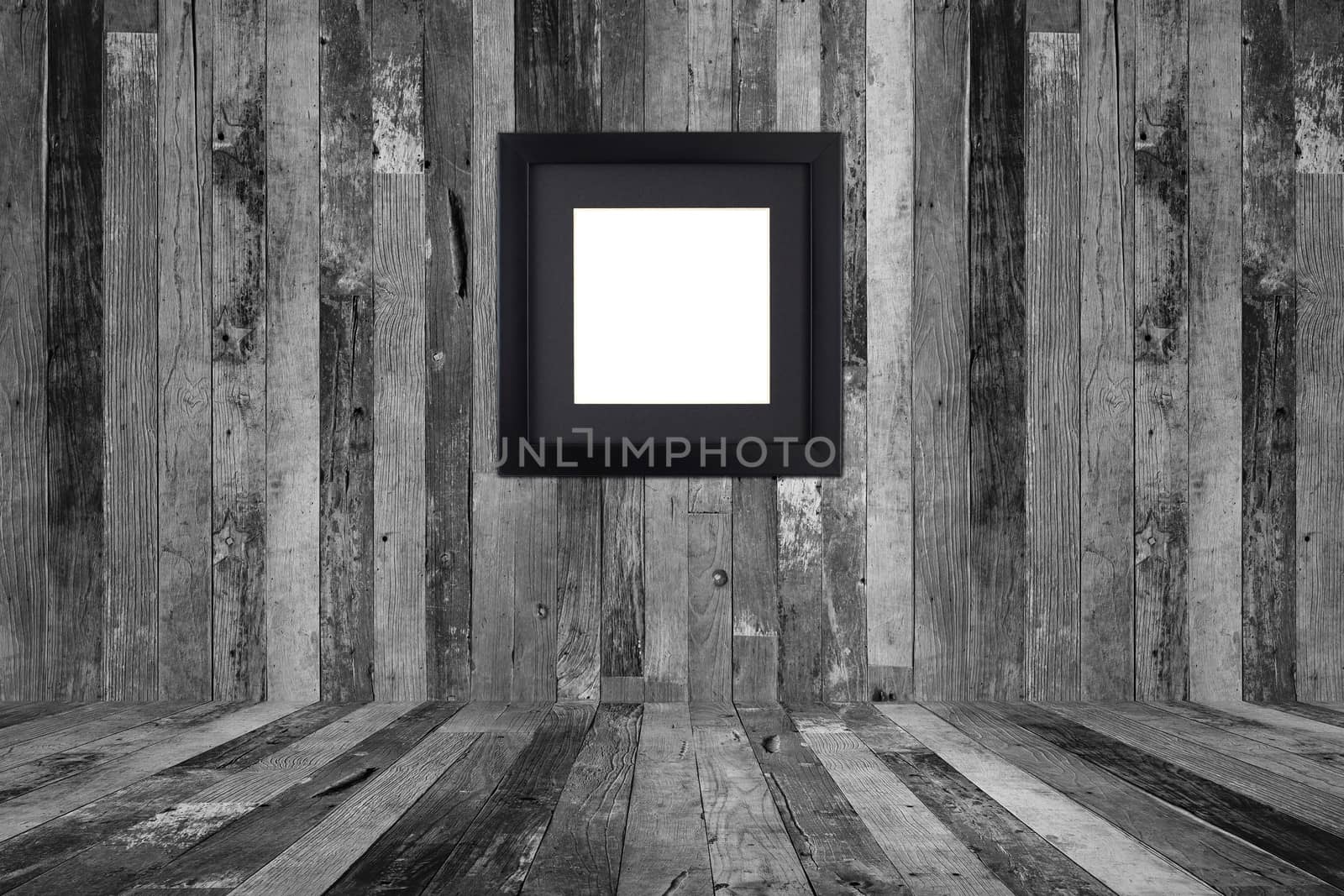 Picture frame on the old wooden wall