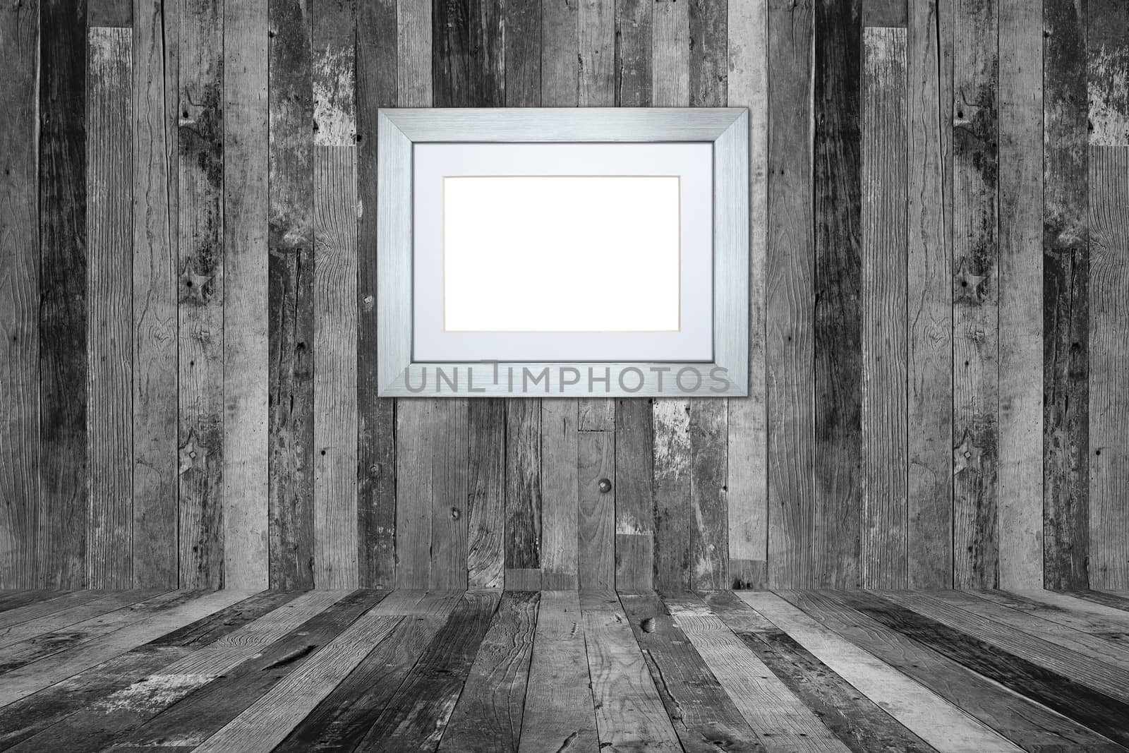 Picture frame on the old wooden wall
