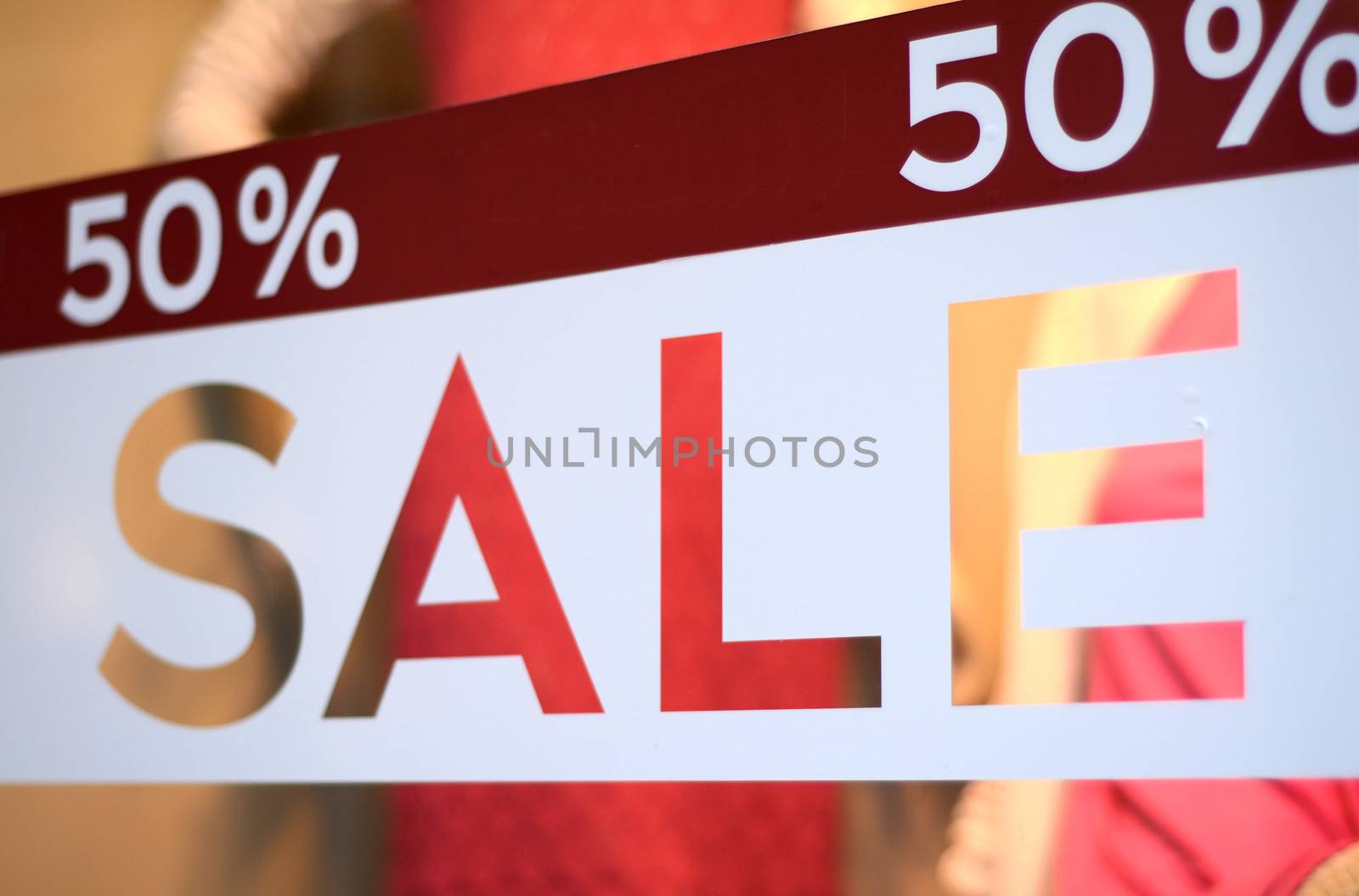 Retail Image Of A Sale Sign In A Clothing Store Window (With Shallow DoF)