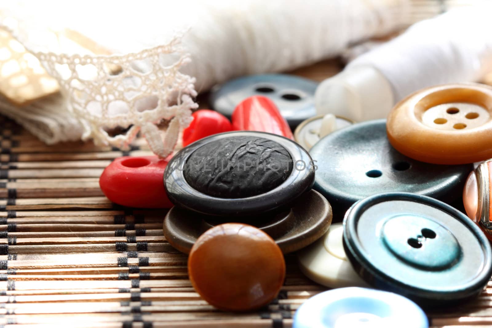 a scattering of old buttons on a napkin