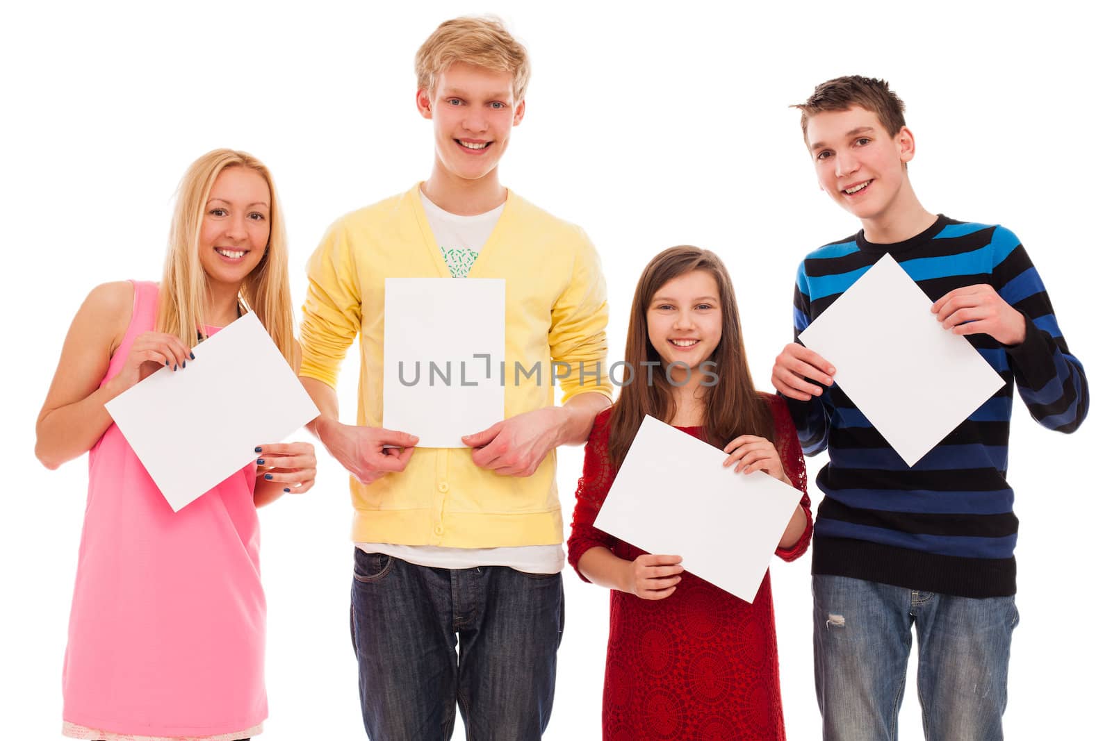 Happy brothers and sisters standing together with empty paper isolated over white background