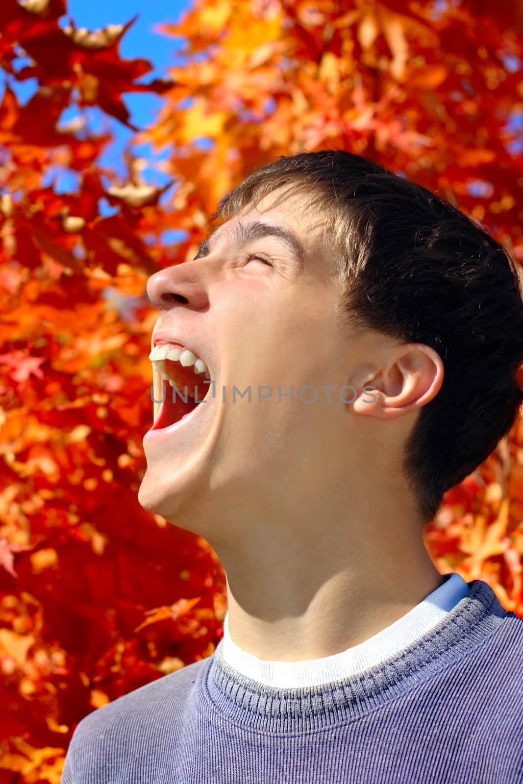 The happy teenager rejoices to the beginning of autumn