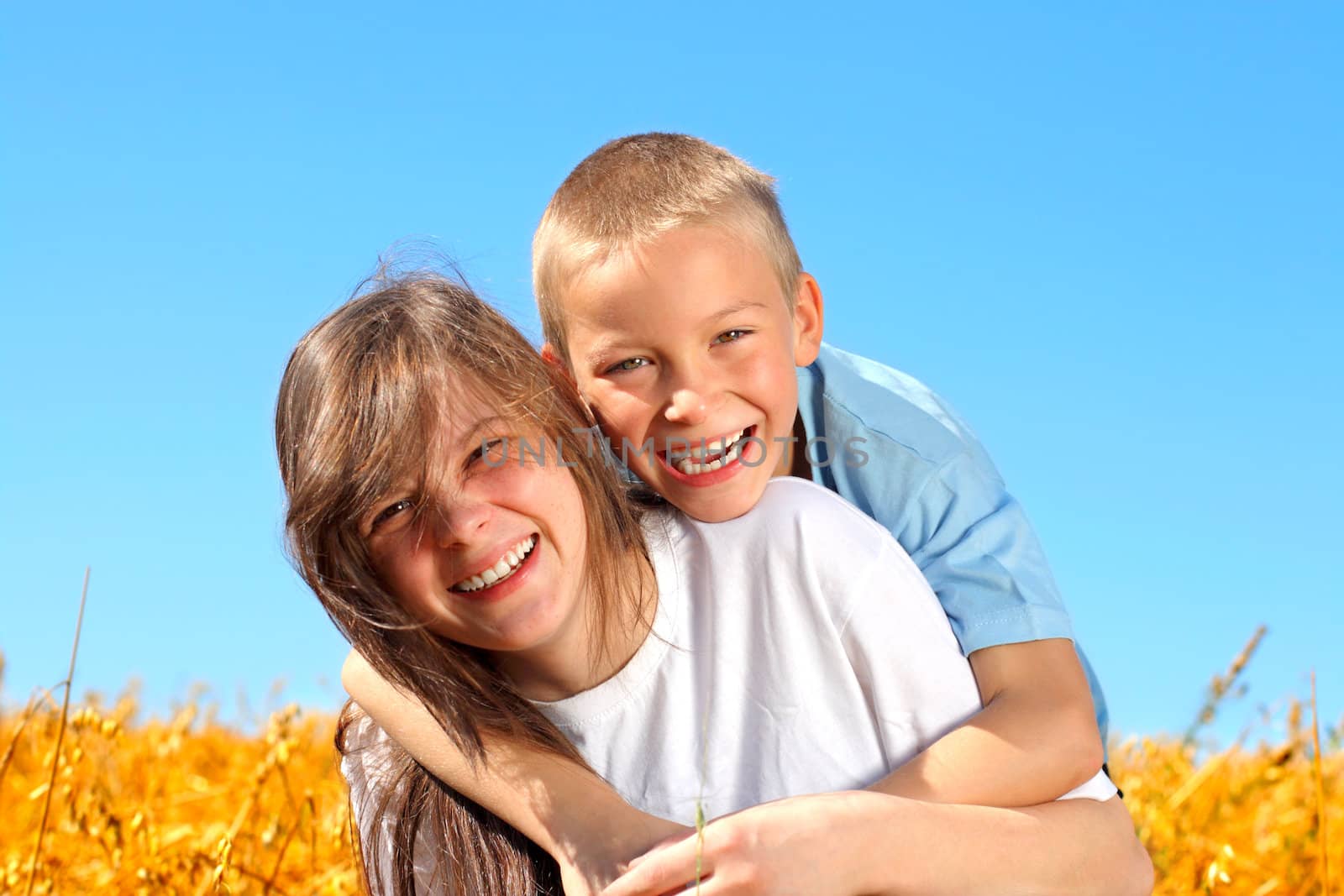 brother and sister in the summer field