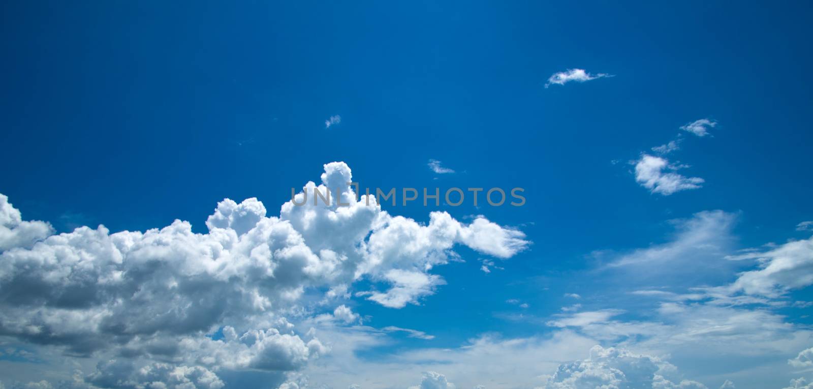 blue sky background with tiny clouds