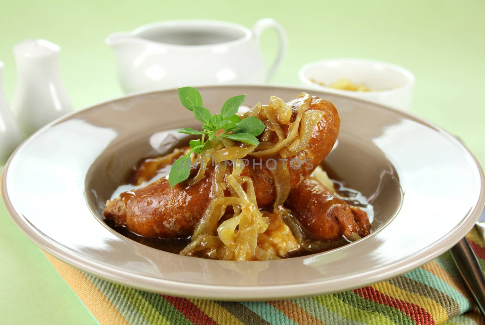 The classic English meal of bangers and mash with gravy ready to serve.