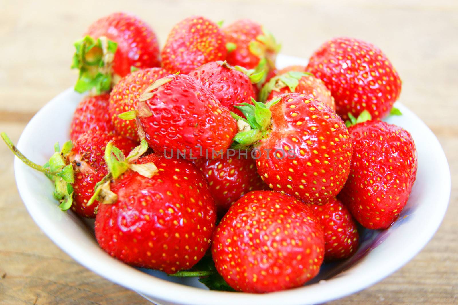 Strawberry on plate by cobol1964