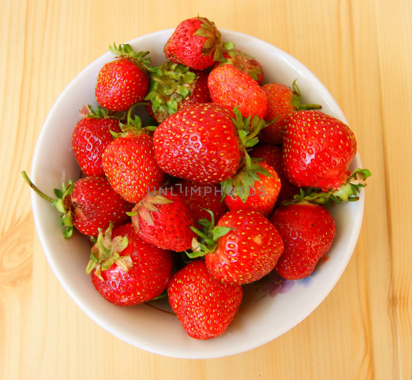 Ripe berry strawberry on wooden table