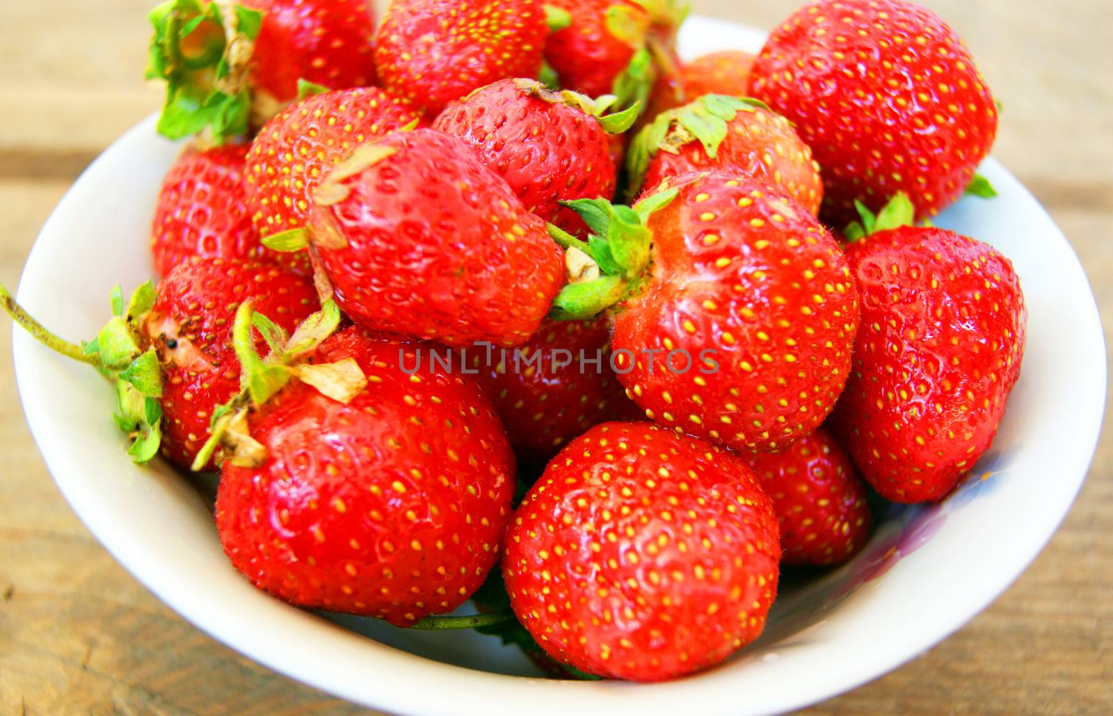 Much ripe berries strawberry on table