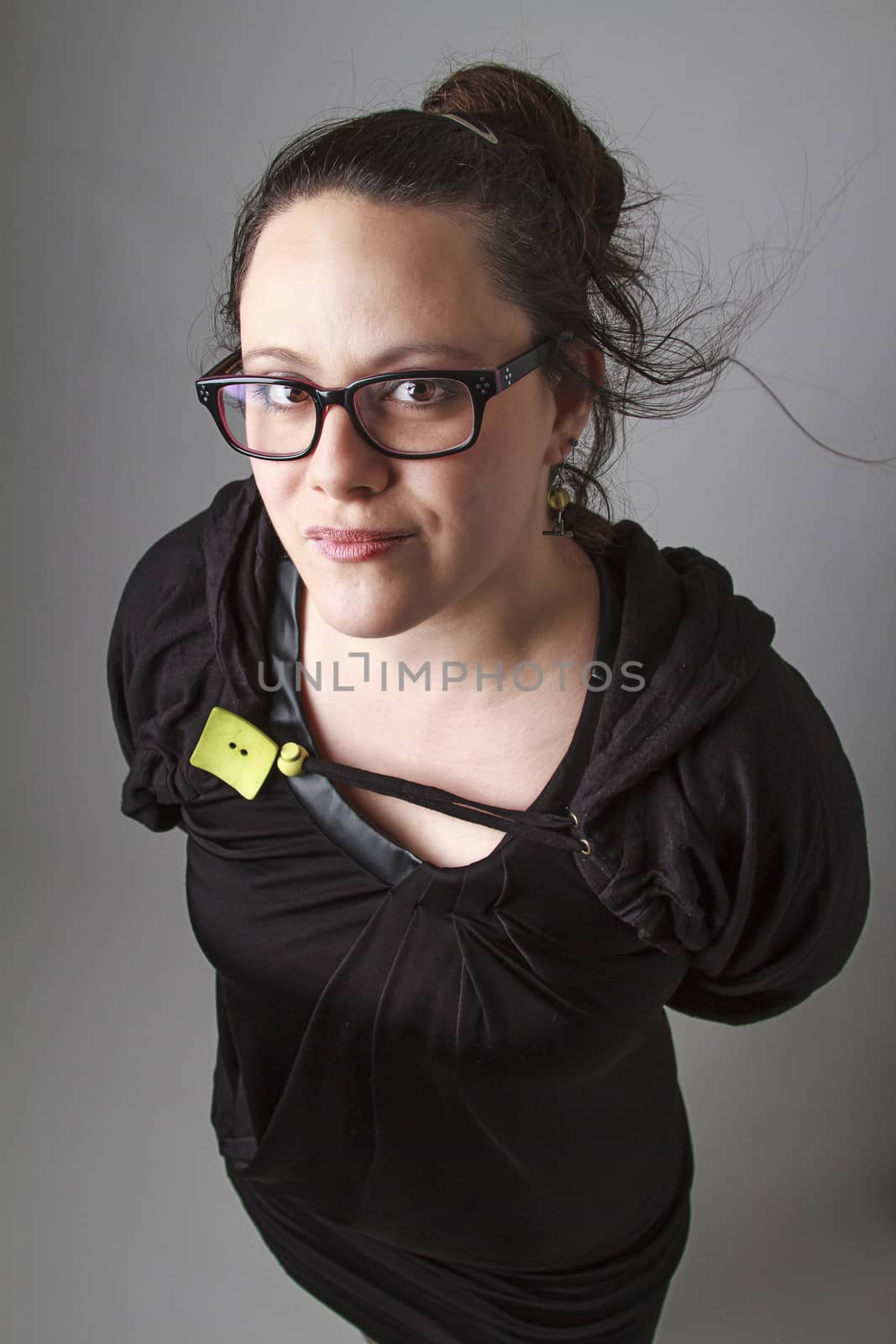 Woman wearing a black dress with wispy flowing hair