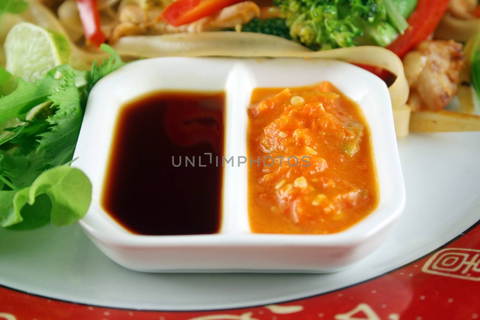 Chicken and rice noodle stirfry with soy and sambal olek dipping sauces.