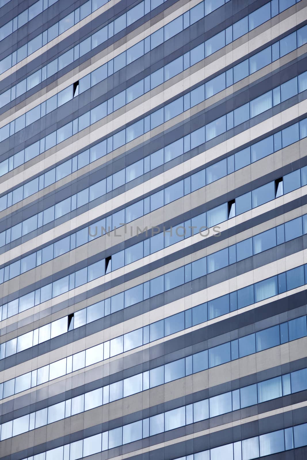 facade of modern building reflecting blue sky