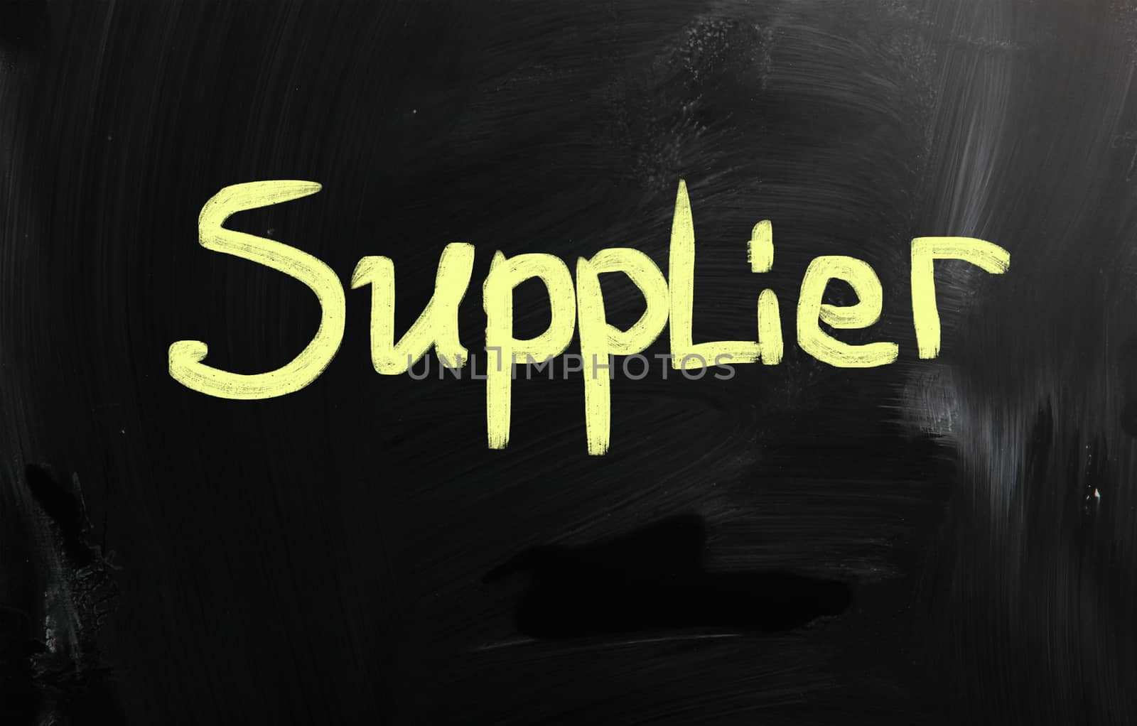Business ideas handwritten with white chalk on a blackboard.