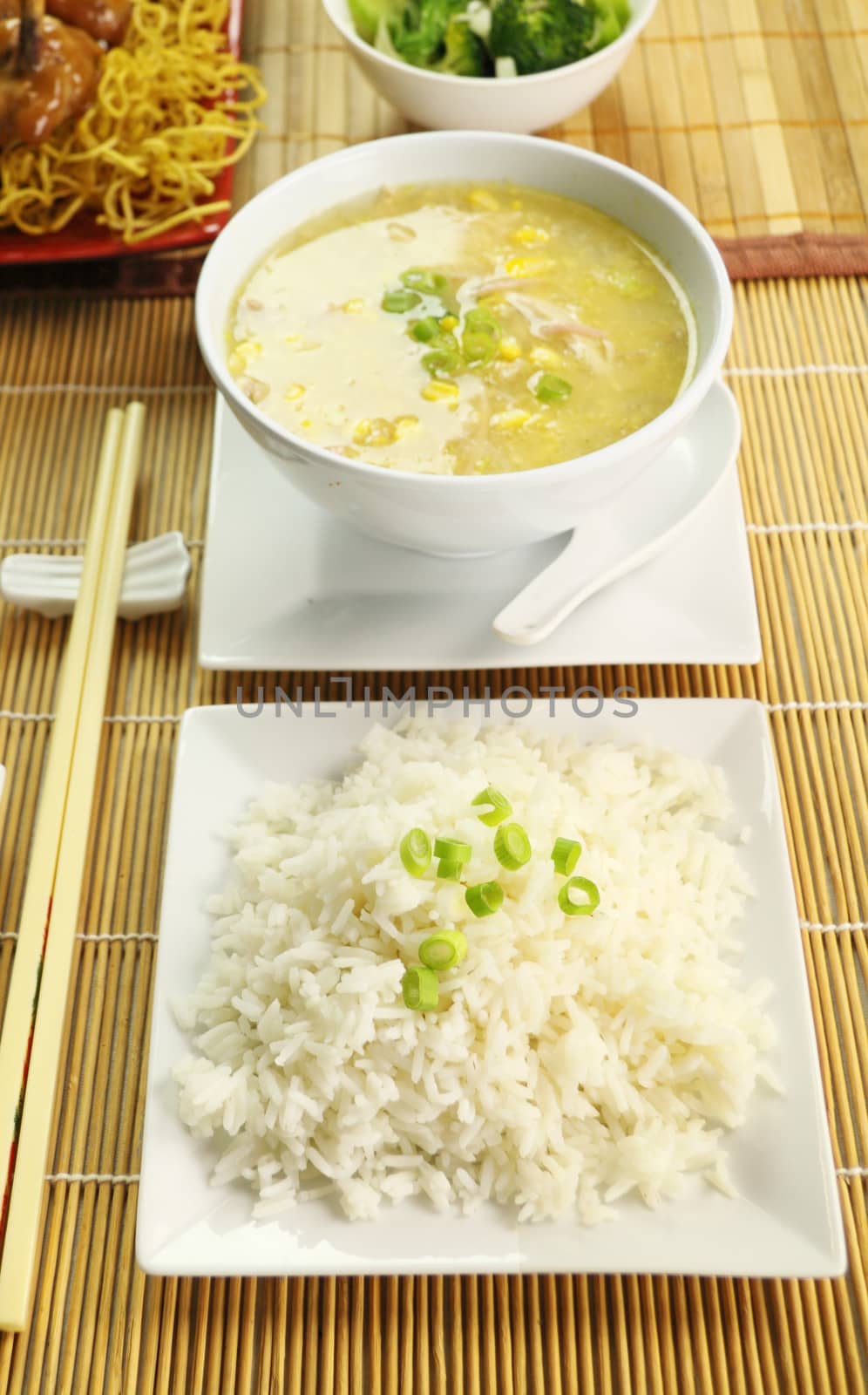 Boiled rice and chicken and corn soup ready to serve.