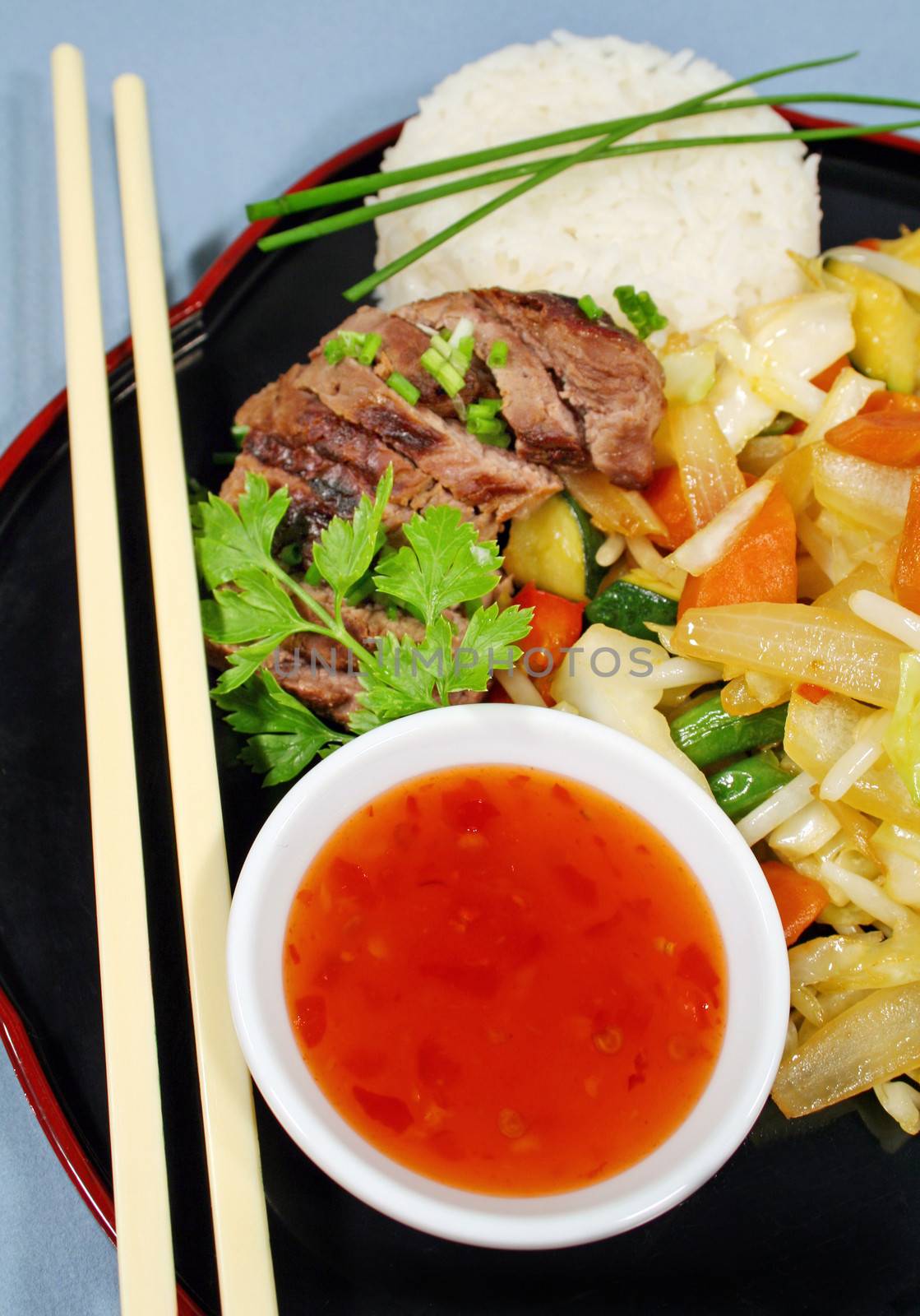 Braised lamb with stir fry vegetables main course.