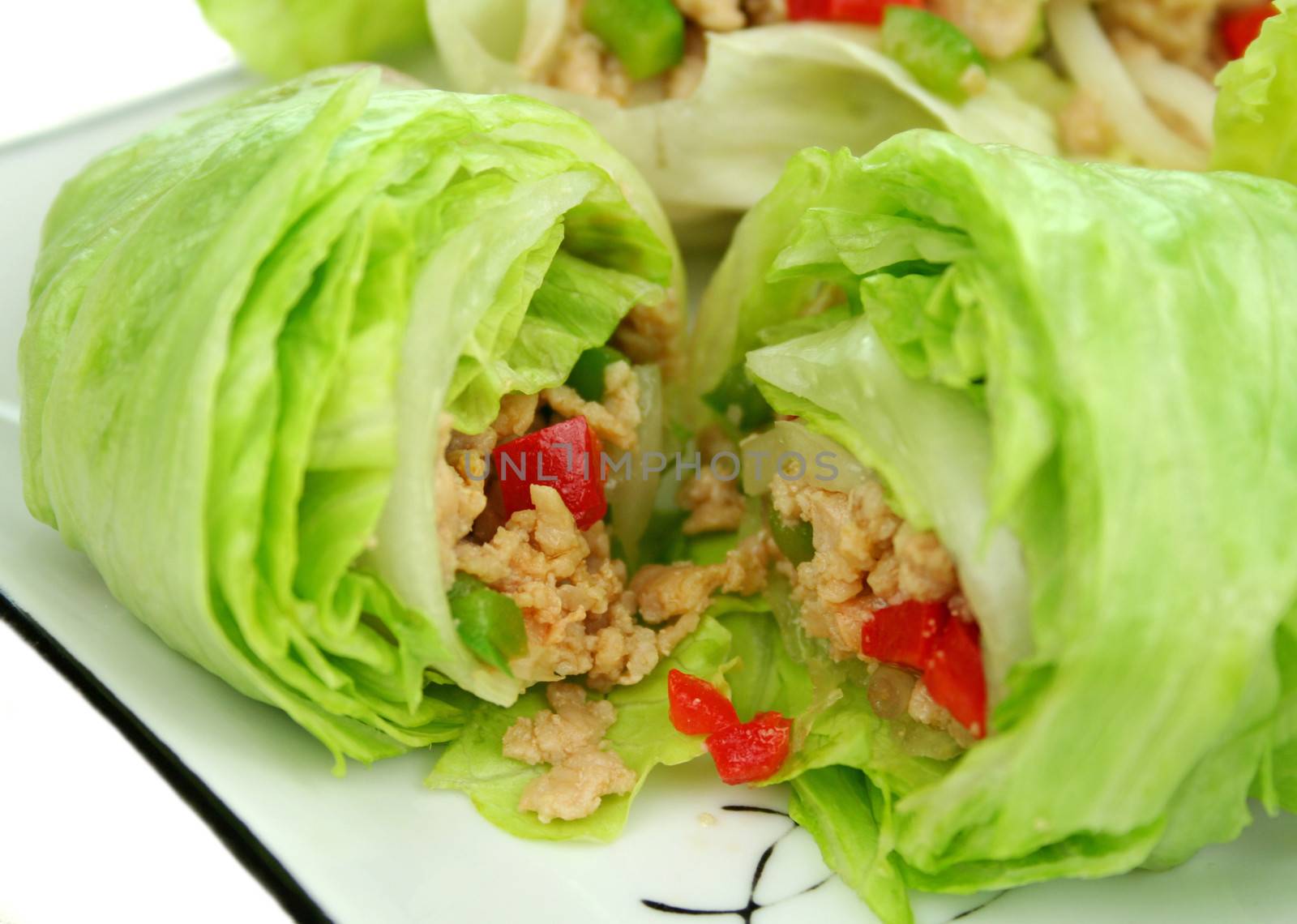 Delicious San Choy Bow with minced chicken and Chinese vegetables wrapped in fresh lettuce leaves.